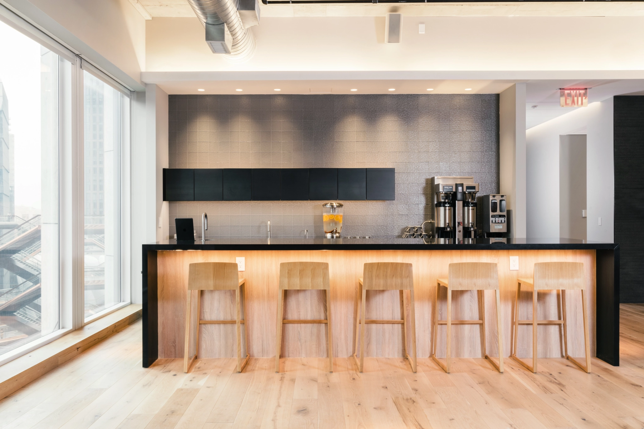 A New York office with a bar and a view of the city.