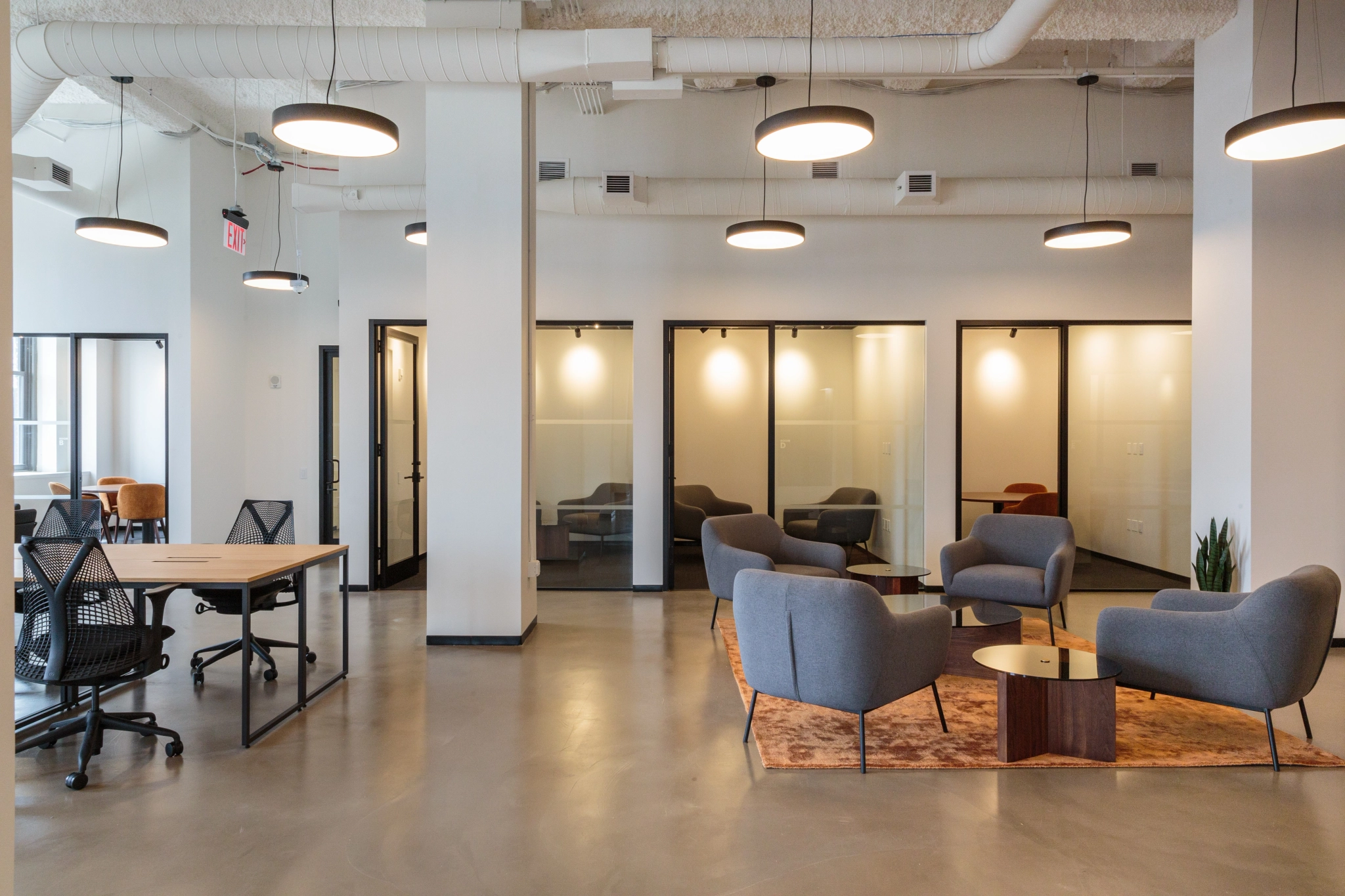 A Manhattan office workspace with modern chairs and tables.