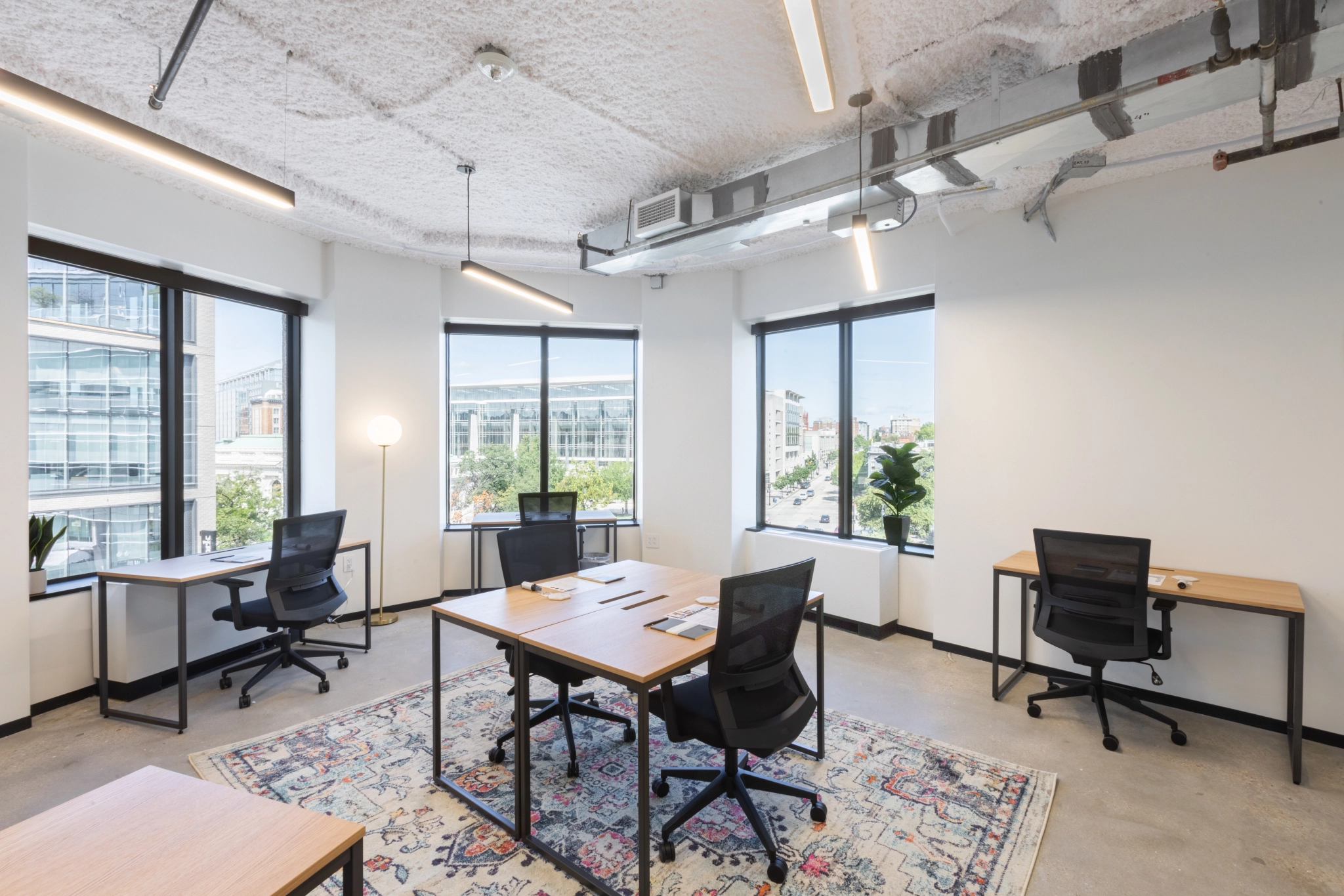 A modern office in Washington with a desk, chairs and a window.