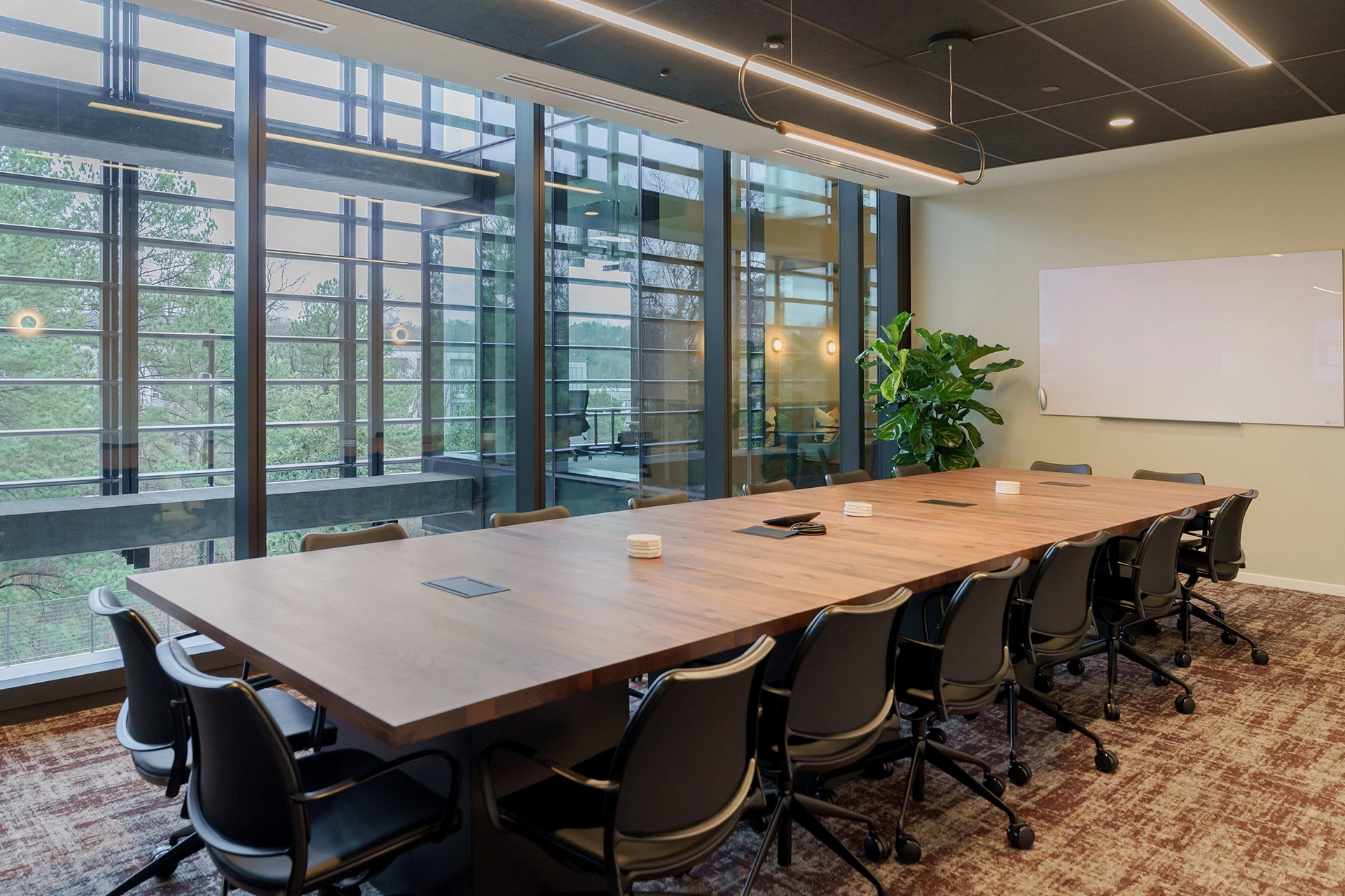 A meeting room with a large table and chairs in Atlanta.
