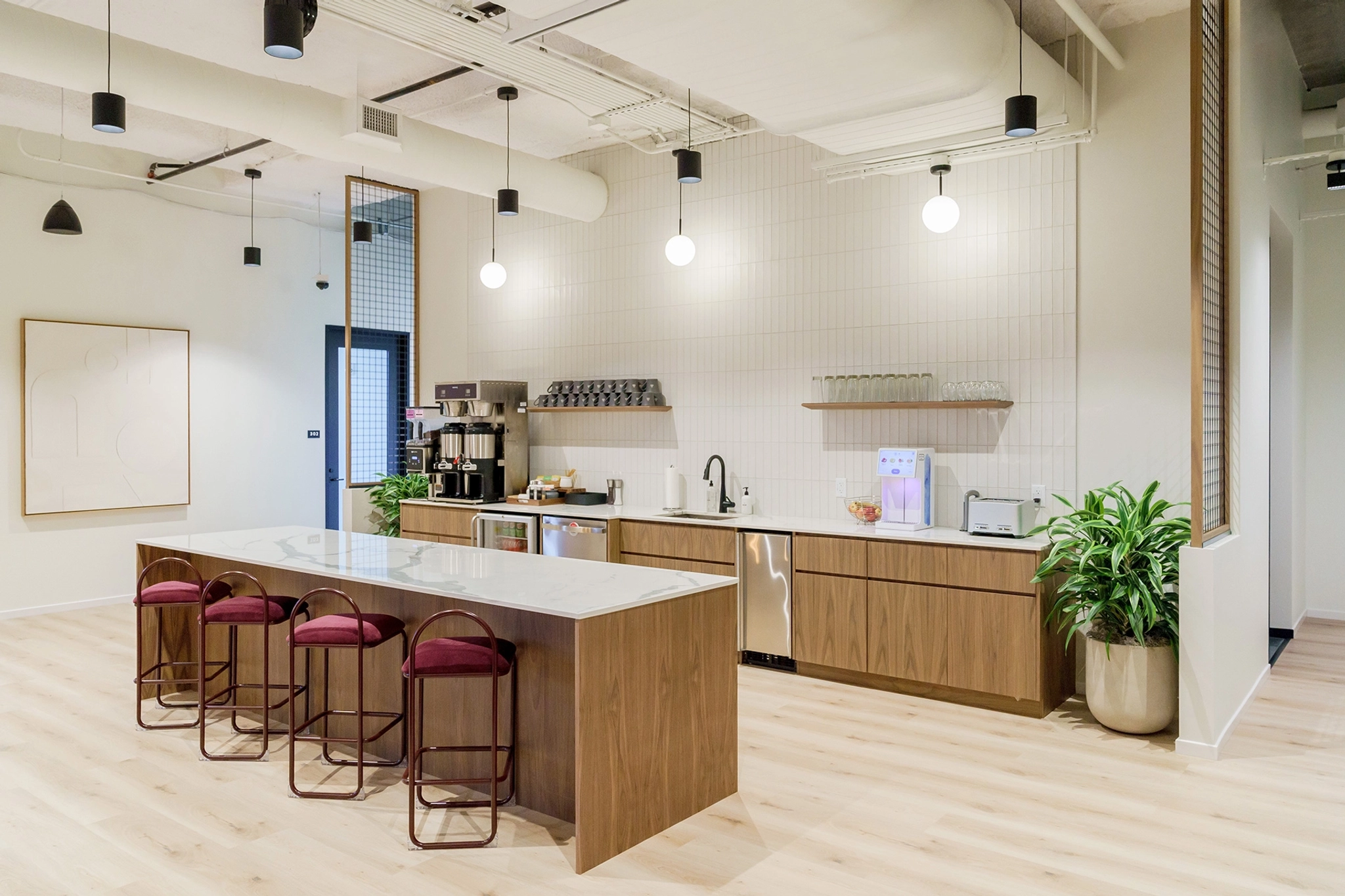 An office with a kitchen and bar stools in Atlanta.