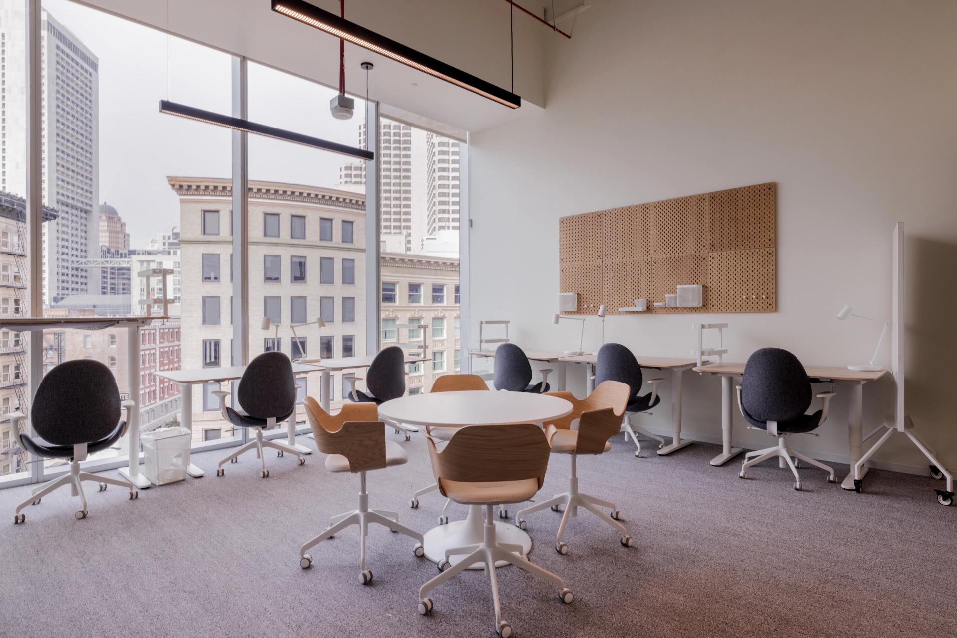 A San Francisco meeting room with a table and chairs and a view of the city.