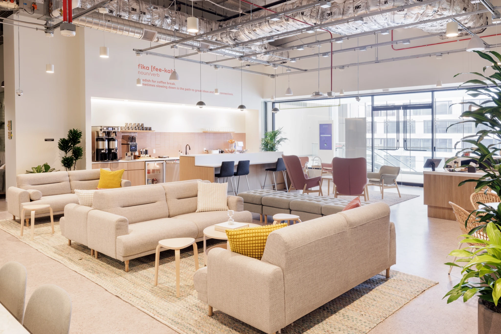 A workspace in San Francisco with couches, tables and plants.