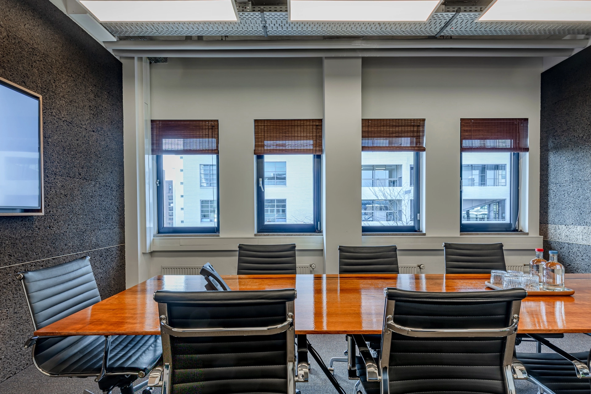 a coworking office with a large table and chairs.