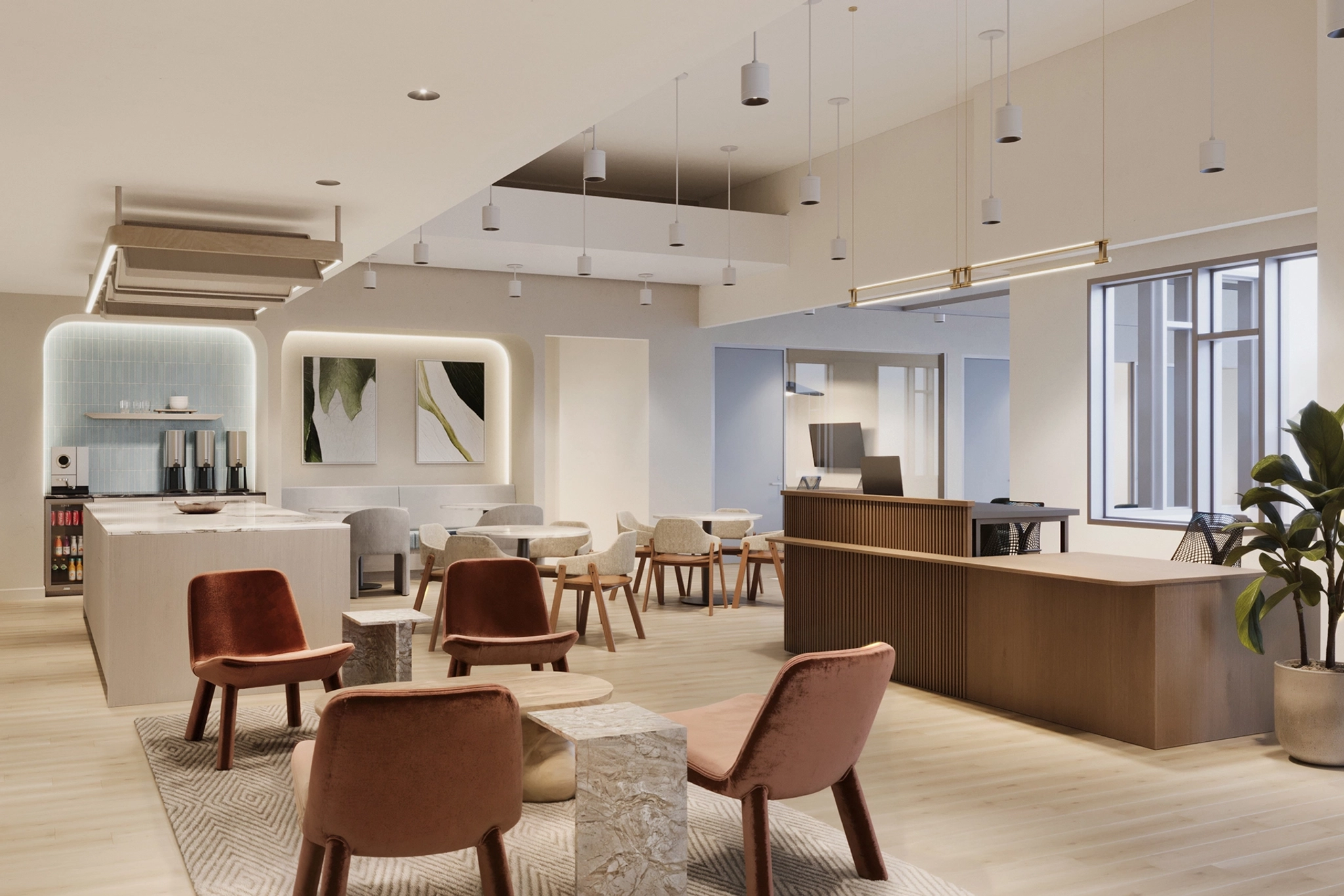 A modern communal lounge area in Santa Monica with a mix of tables, chairs, and bar seating. The space, which can double as a meeting room, is decorated with contemporary art, plants, and pendant lighting. Large windows provide natural light.