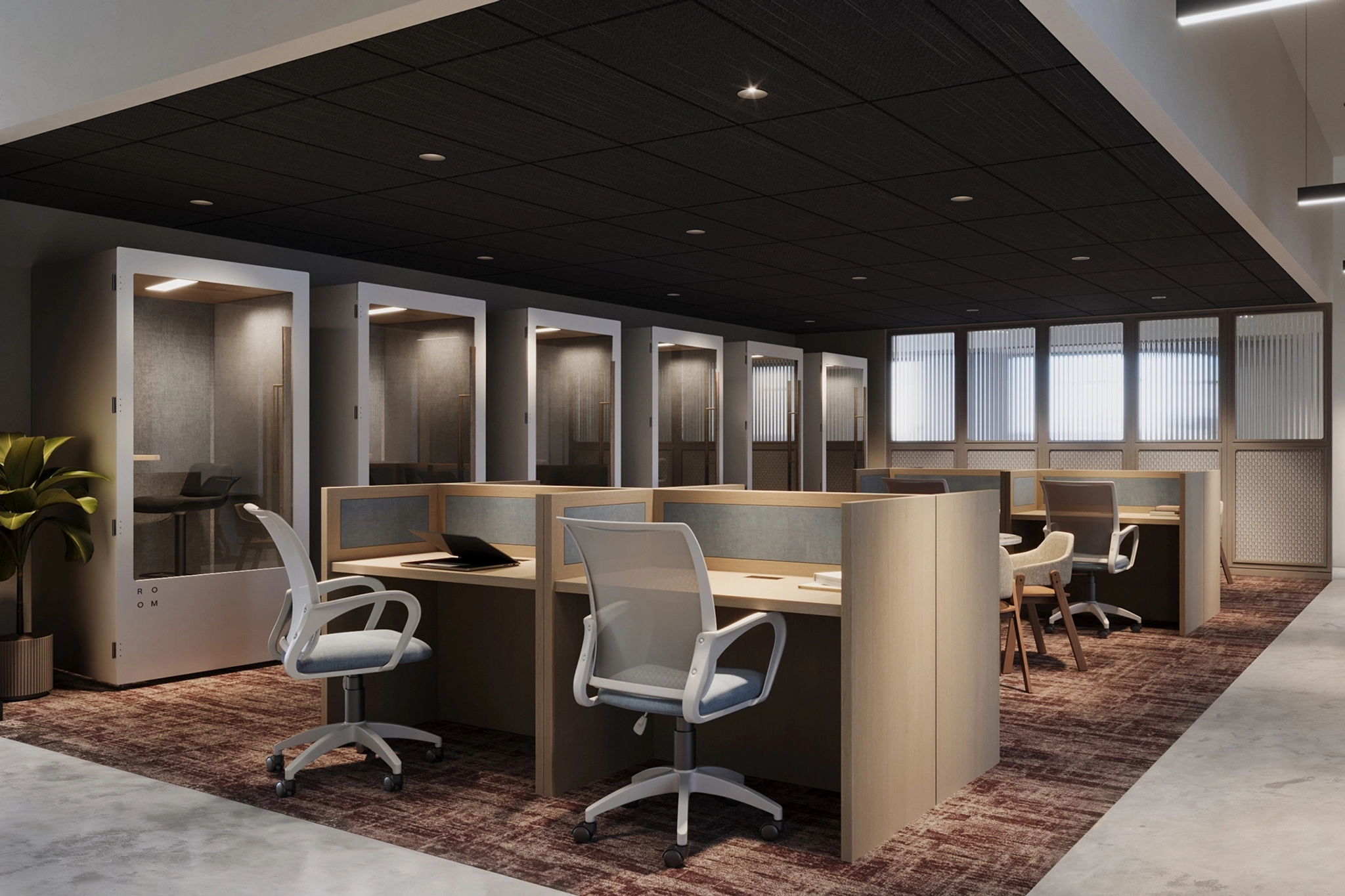 A modern coworking space with individual workstations, ergonomic chairs, and private phone booths in the background, featuring neutral colors and contemporary design elements. Just beyond the workstations, a sleek meeting room offers additional collaborative opportunities.