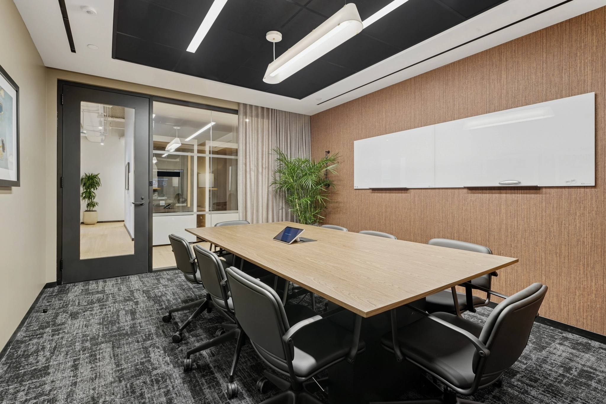 a large, bright meeting room with a large screen
