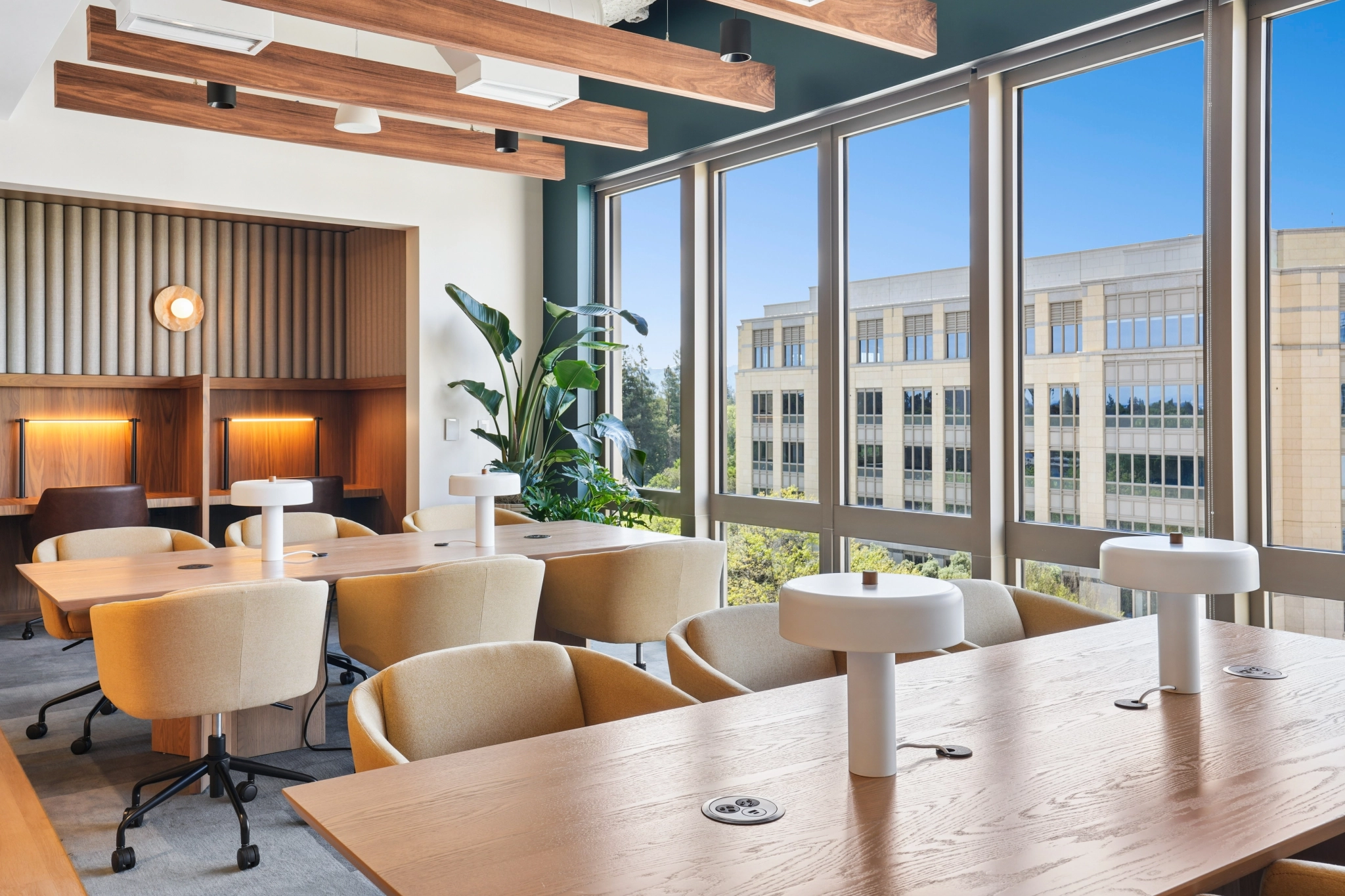 a large, bright meeting room with a large screen