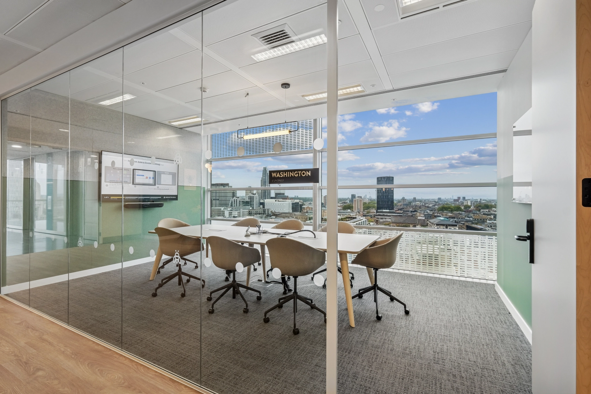 a large, bright meeting room with a large screen