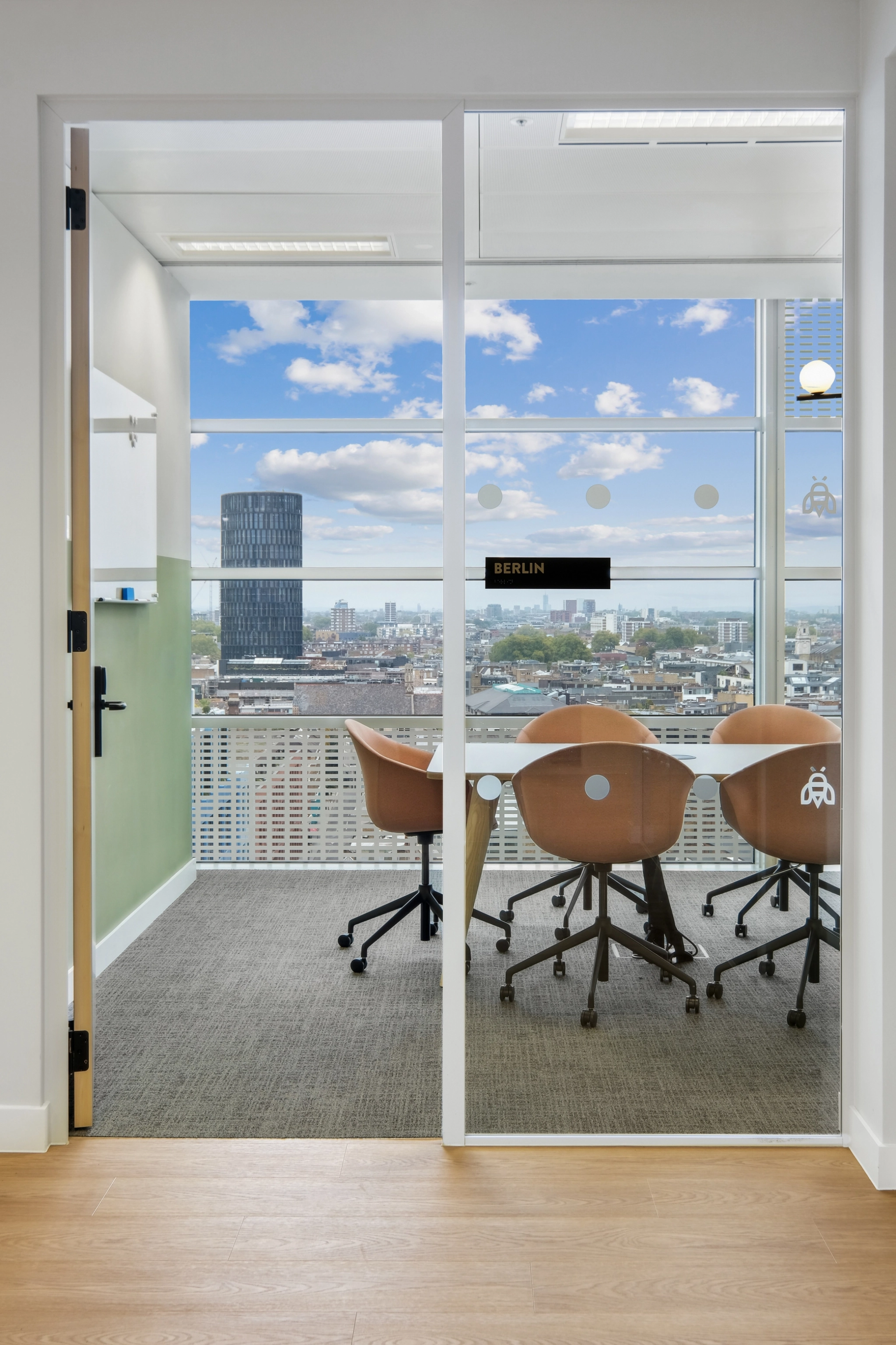 a large, bright meeting room with a large screen