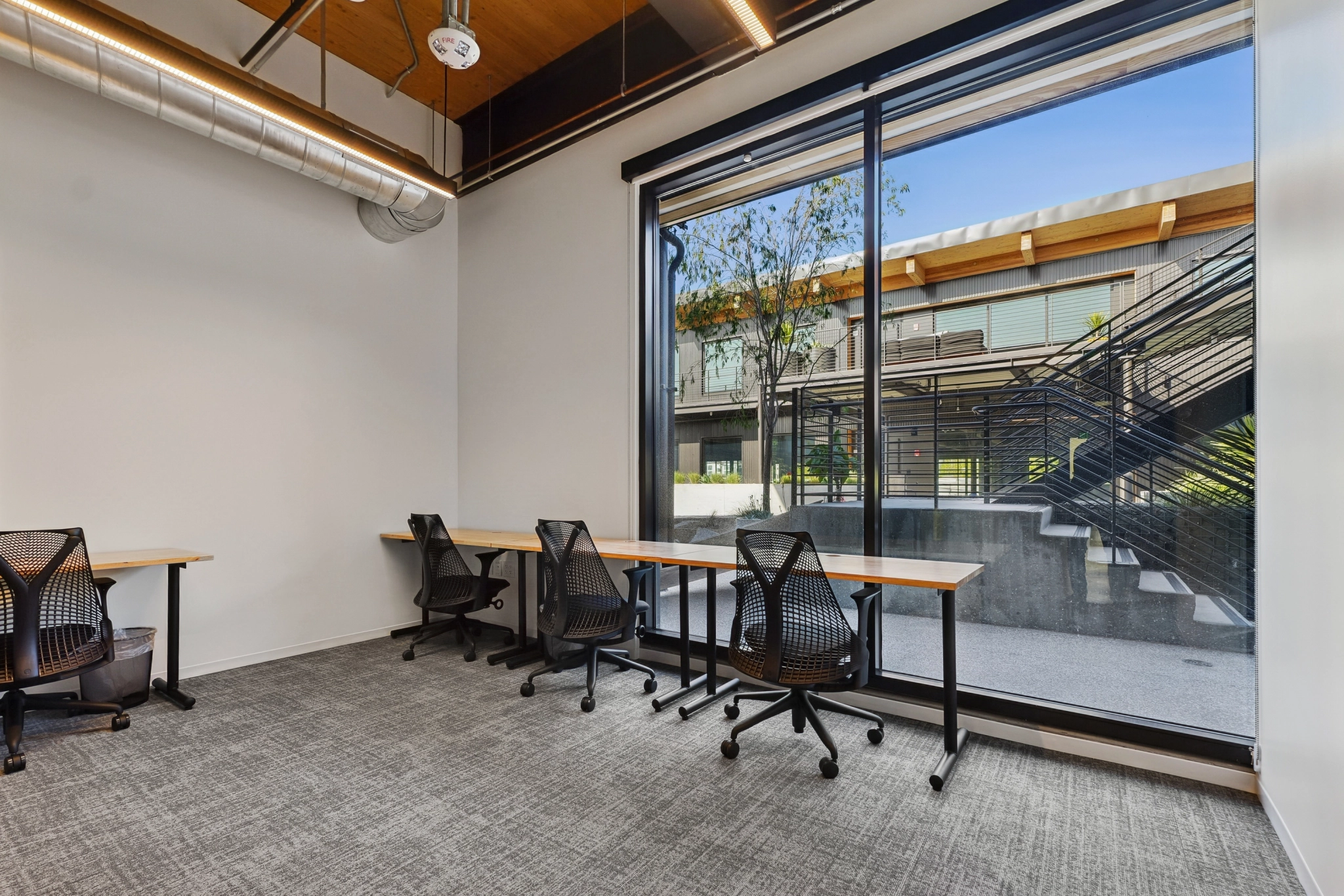 a large, bright meeting room with a large screen