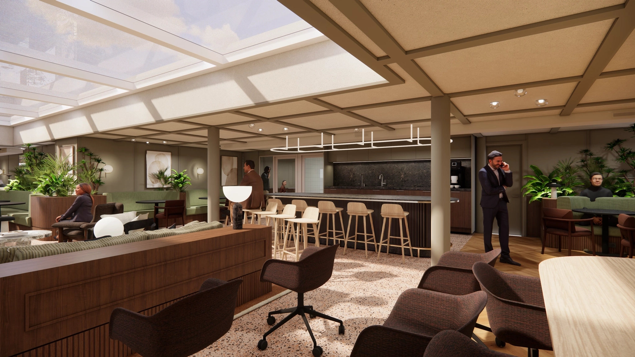 Modern office lounge with coworking bar seating, workstations, plants, and people engaged in conversation or working. Skylights provide natural light.