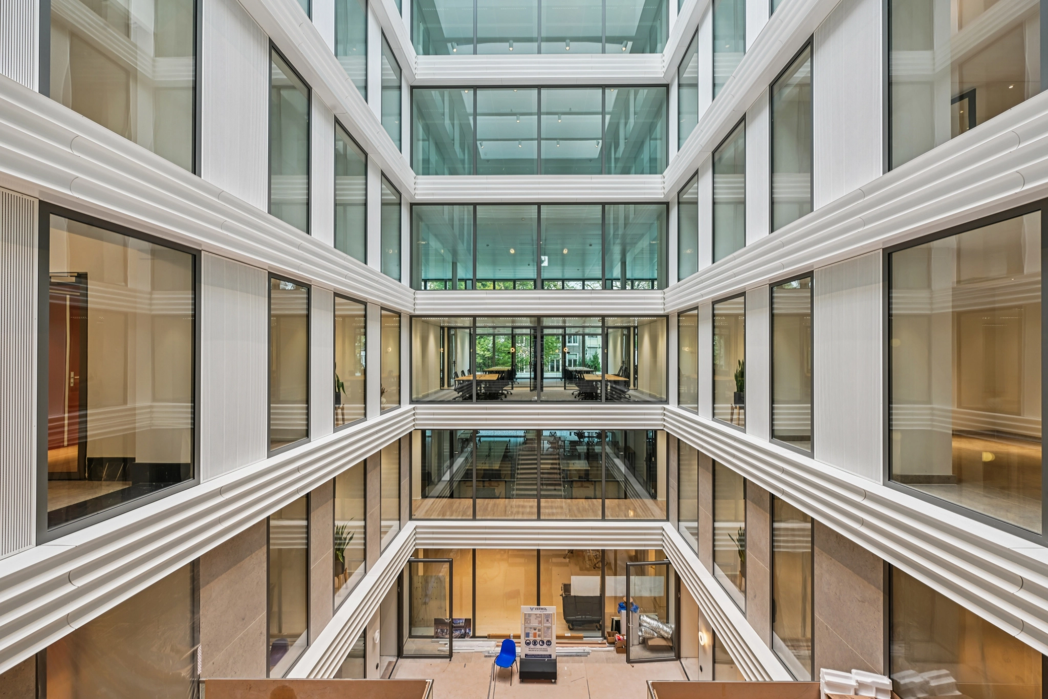 a large, bright meeting room with a large screen