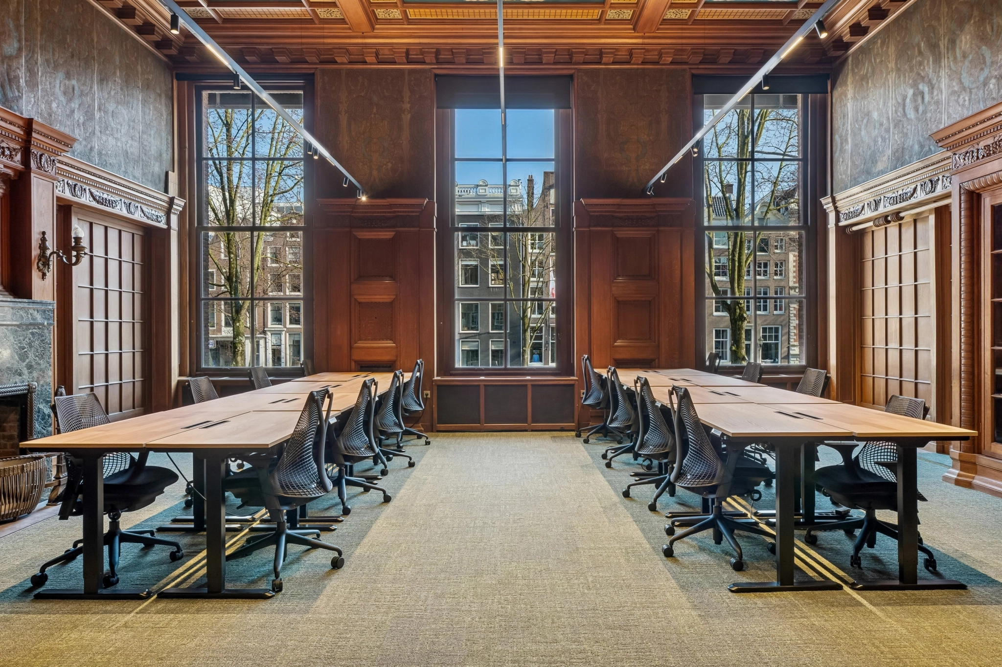 a large, bright meeting room with a large screen
