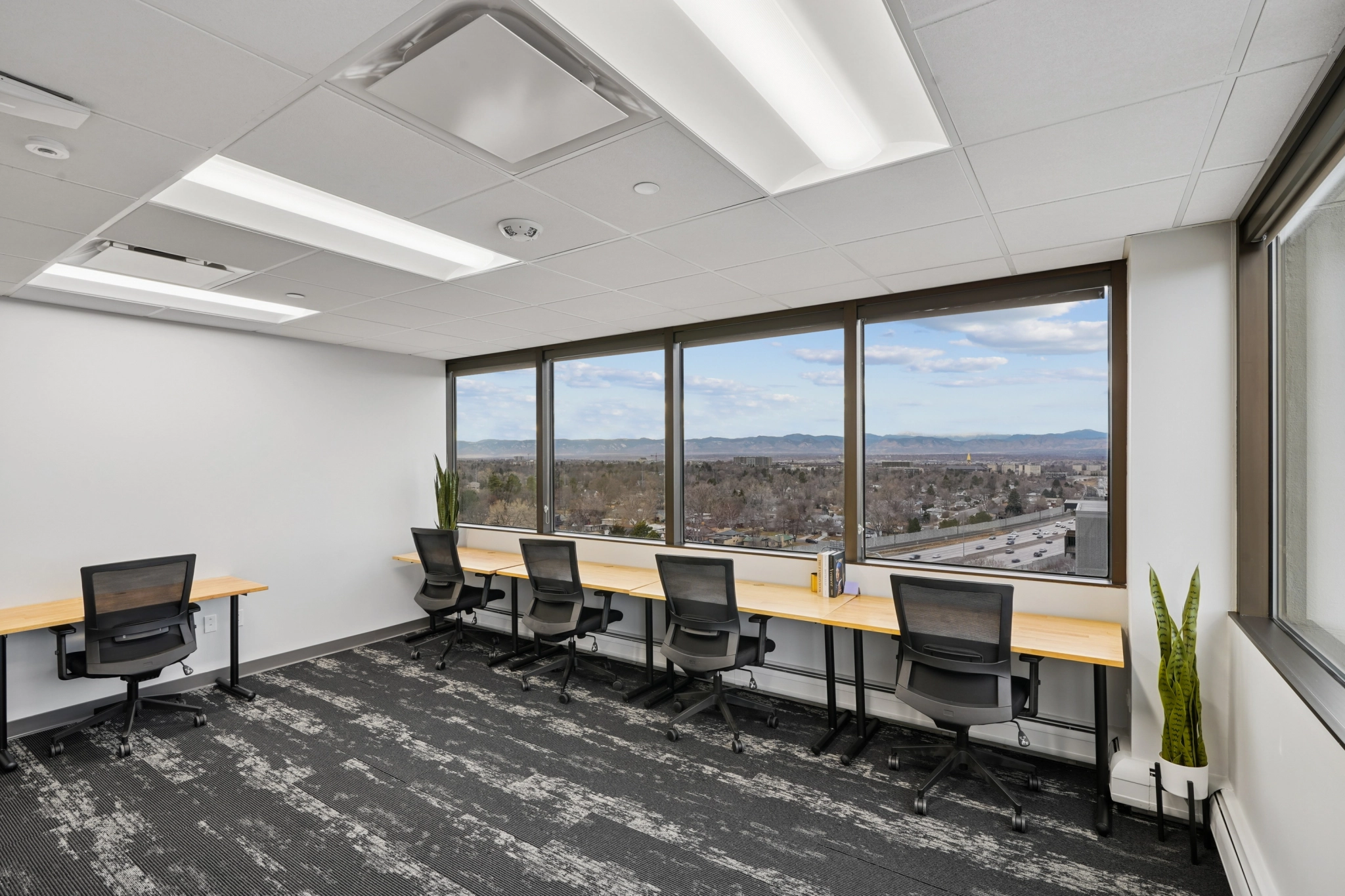 a large, bright meeting room with a large screen