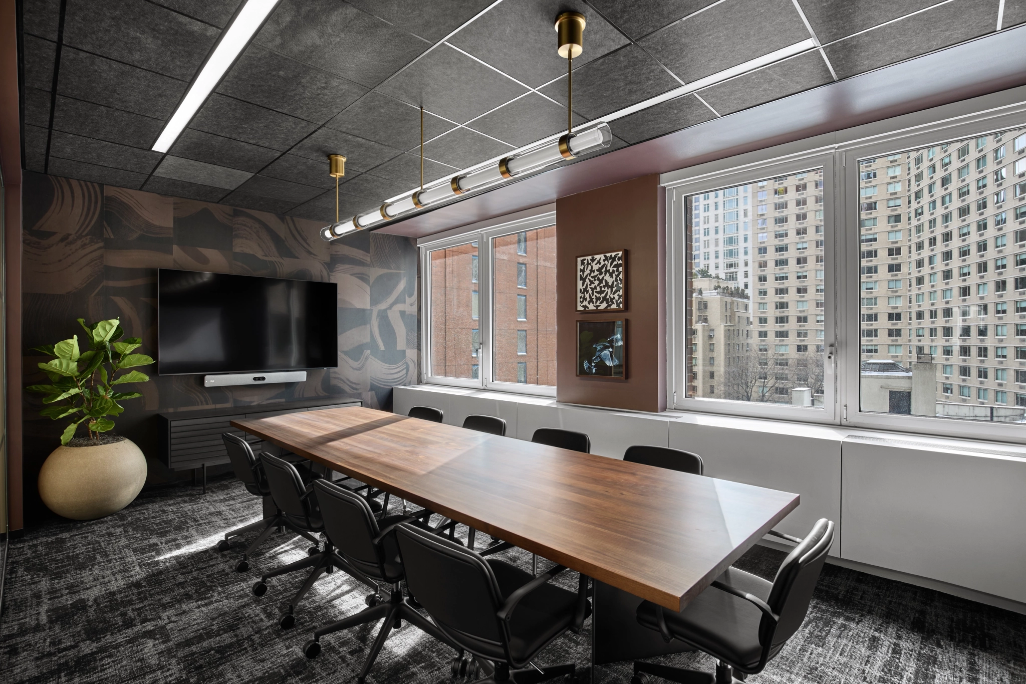 a large, bright meeting room with a large screen