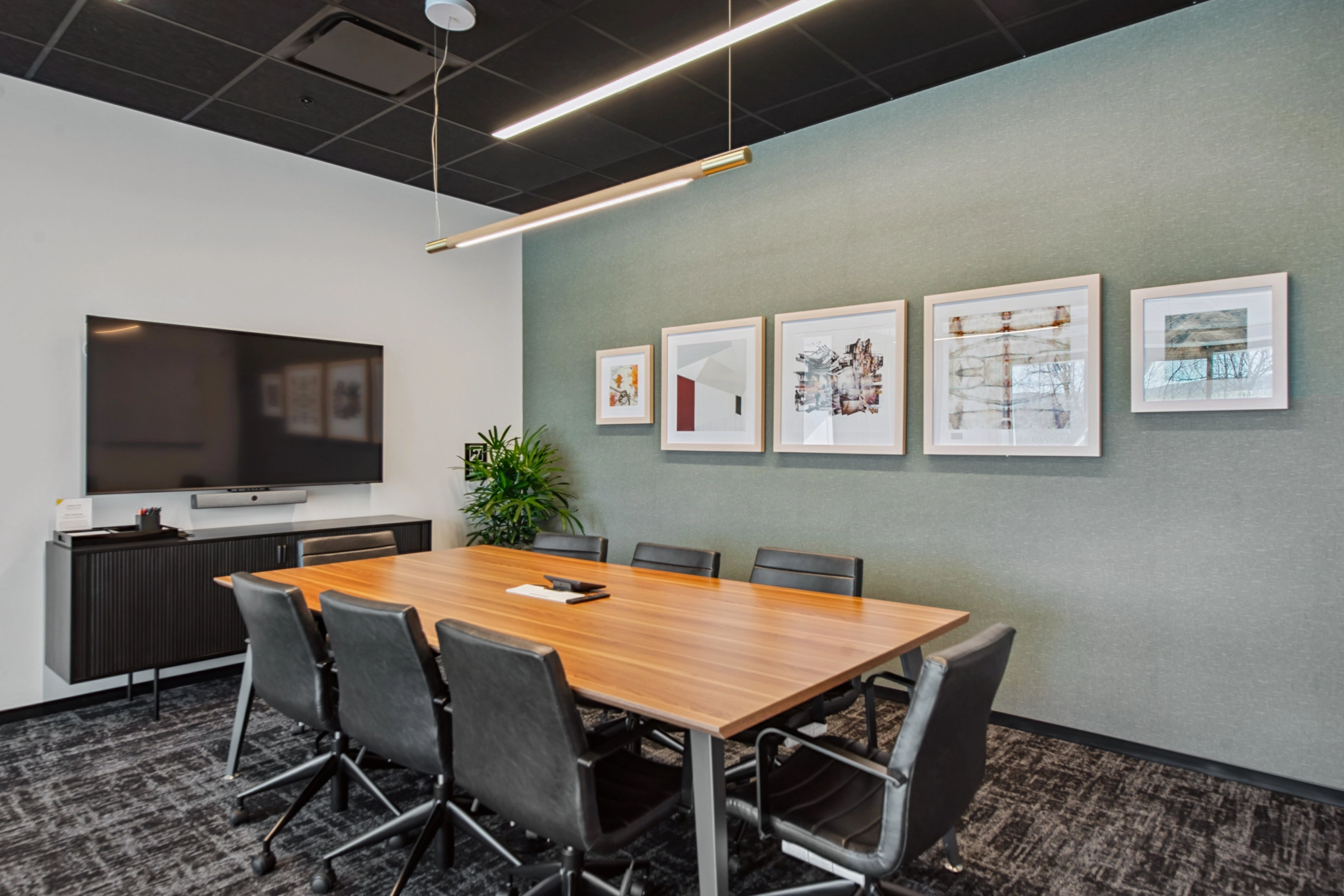 a large, bright meeting room with a large screen