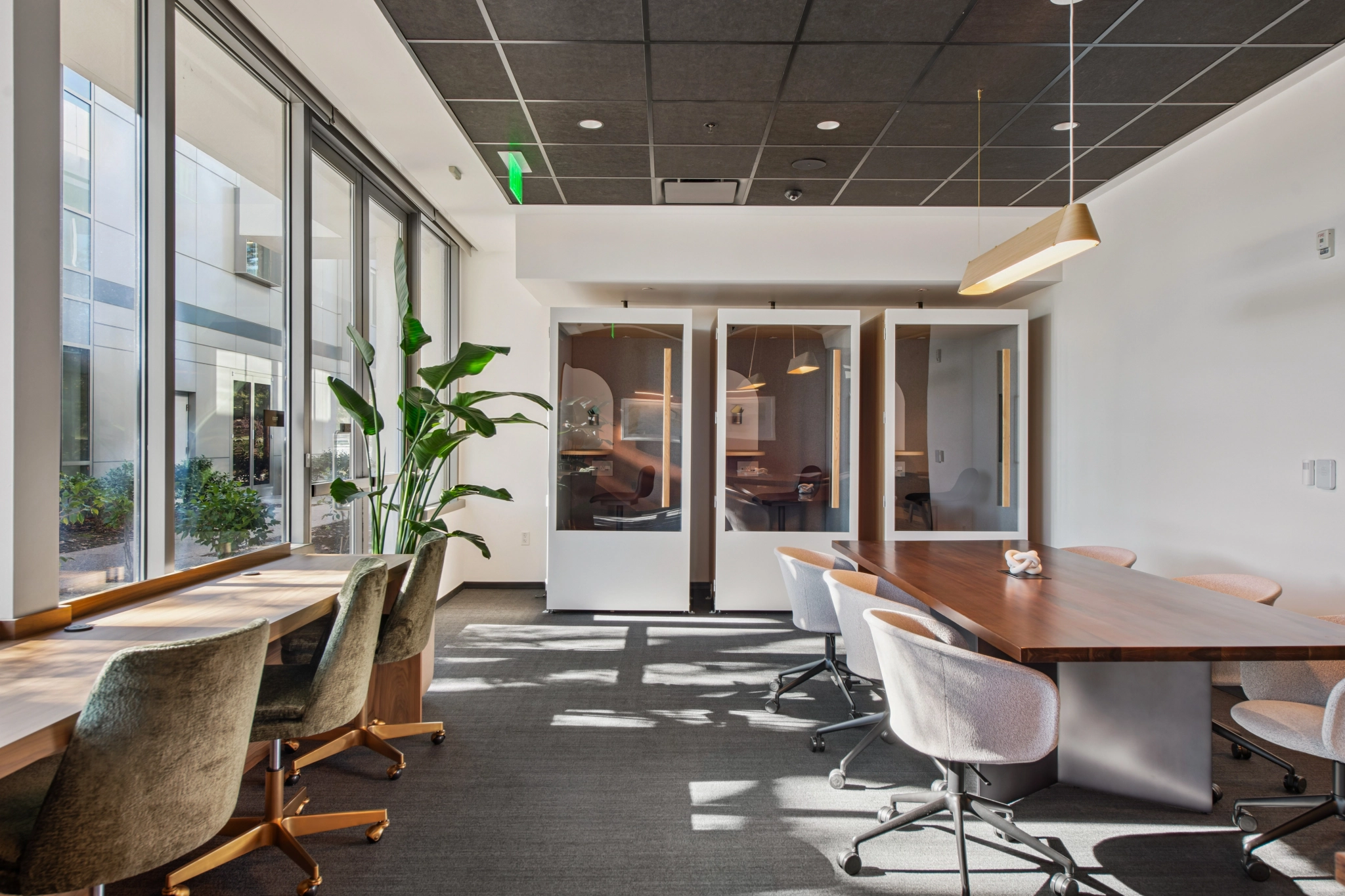 a large, bright meeting room with a large screen