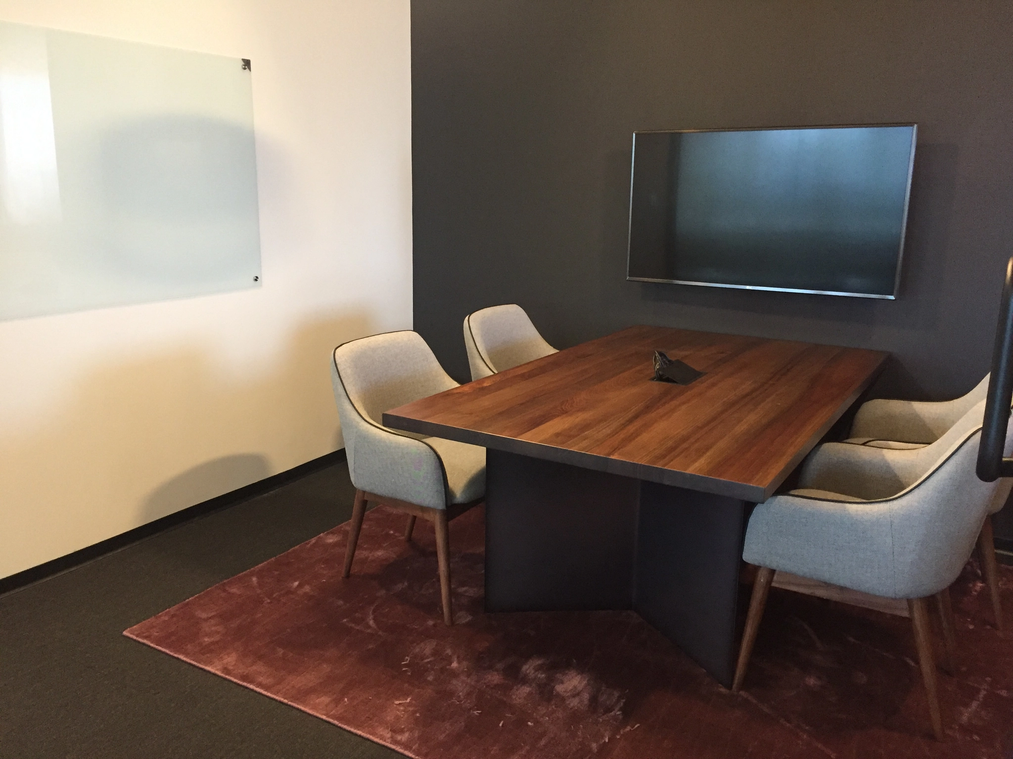 a large, bright meeting room with a large screen