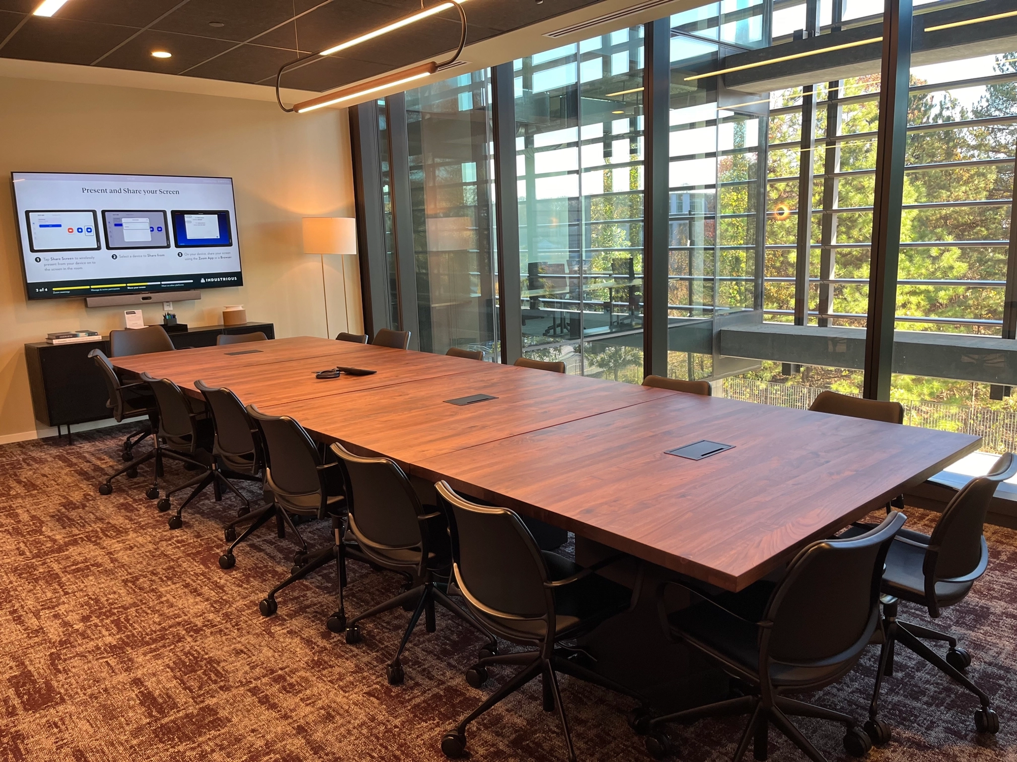 An Atlanta conference room with a large table and large windows, providing an ideal workspace for meetings.