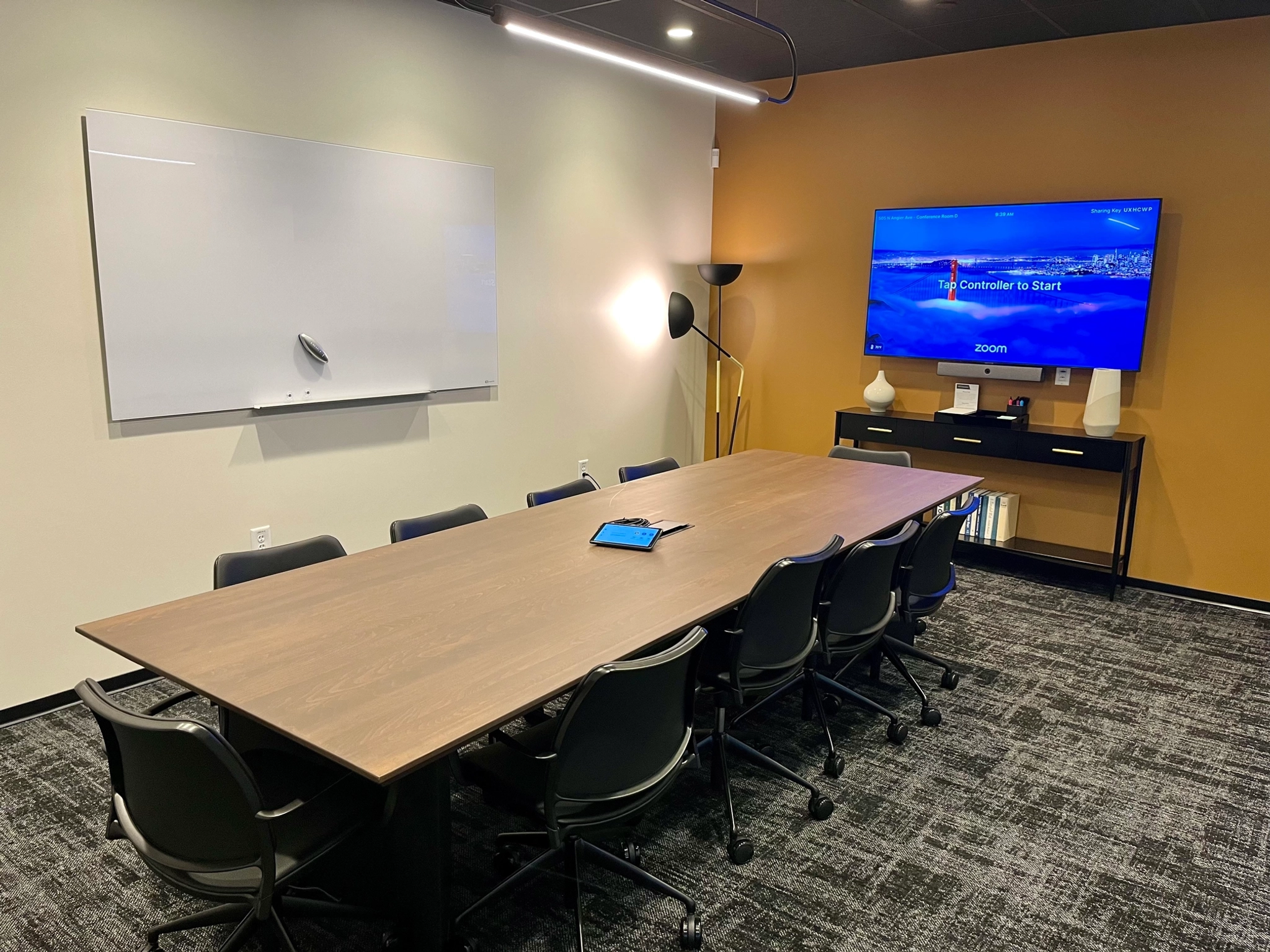 A large conference room with a table and chairs, perfect for coworking in Atlanta.