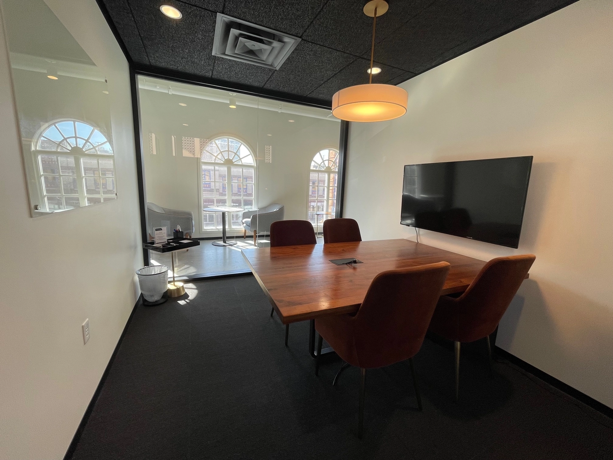 An office conference room with a table and chairs.