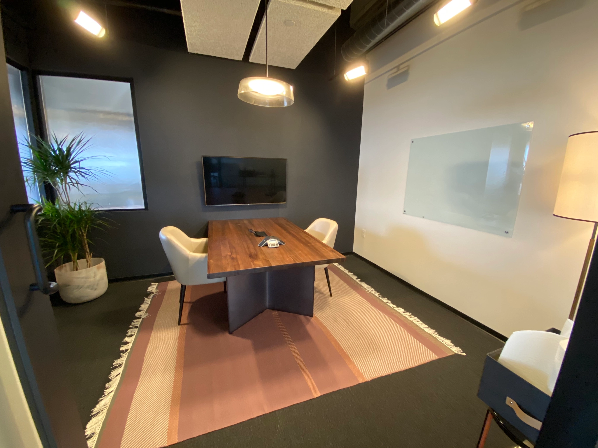 a large, bright meeting room with a large screen