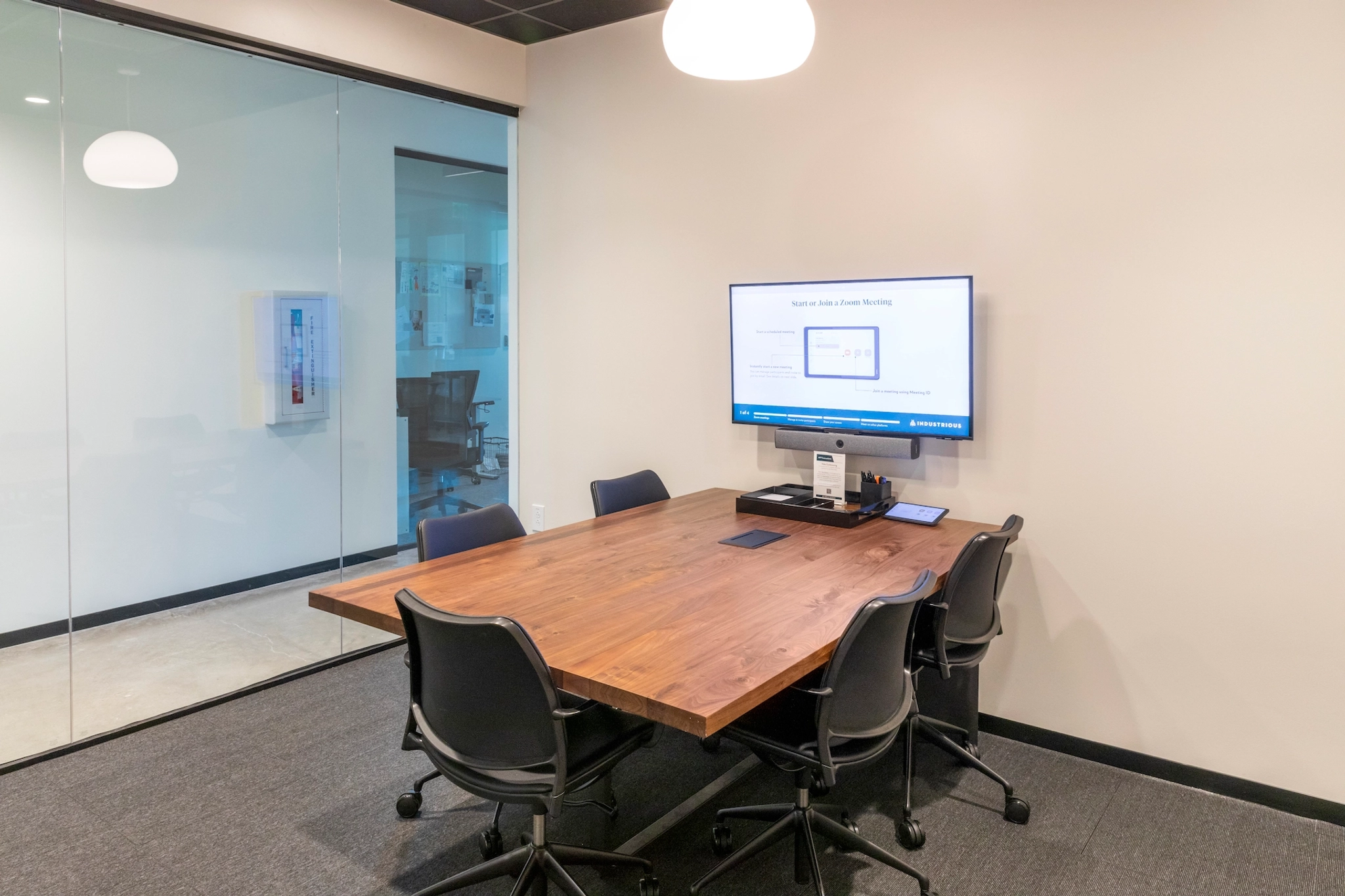 A coworking space equipped with a table and chairs perfect for meetings.