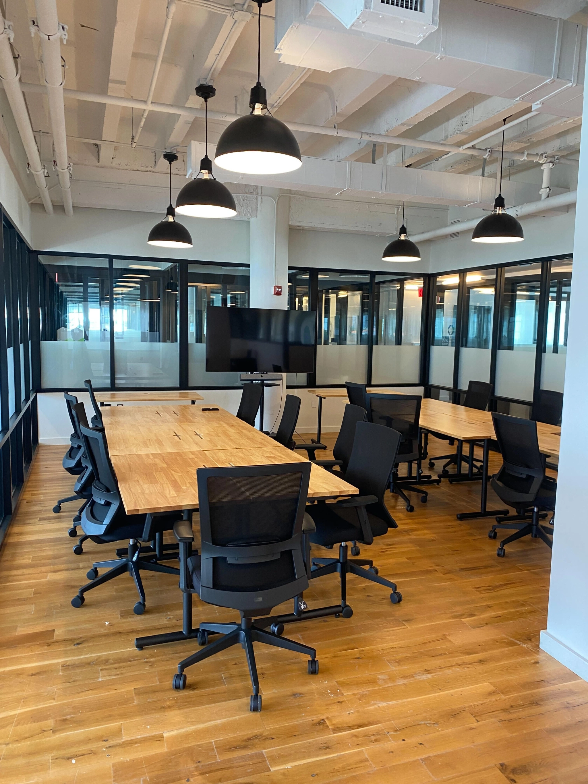 An office conference room in Miami Beach with a wooden table and chairs.