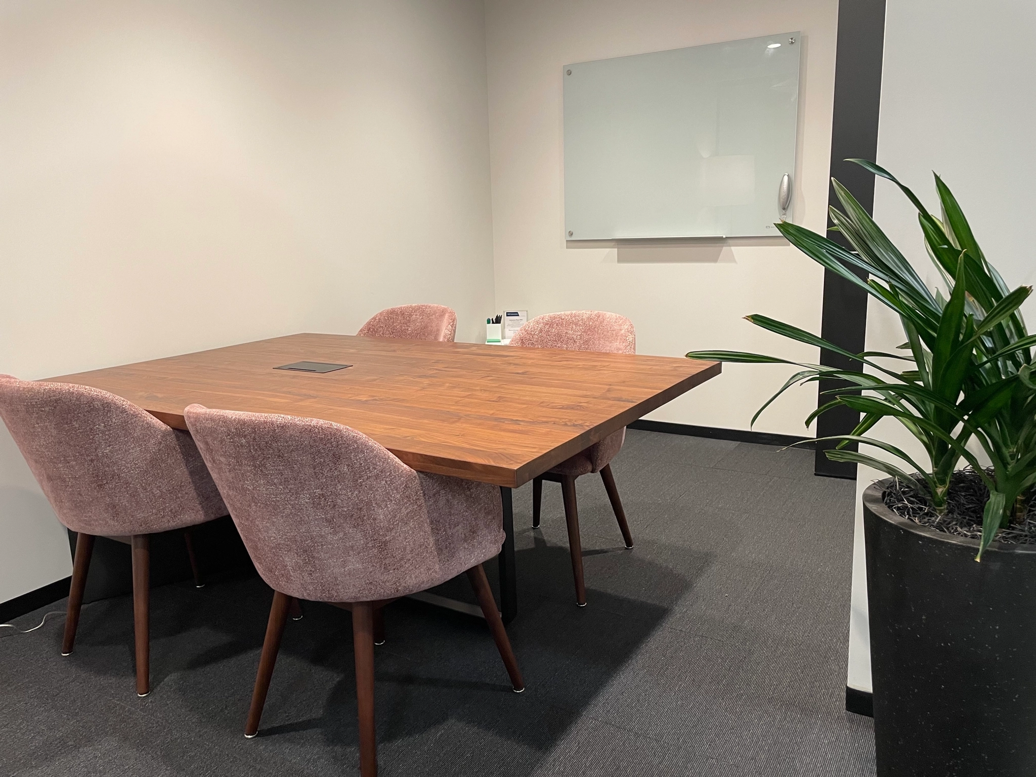 A coworking office space with a table and chairs.