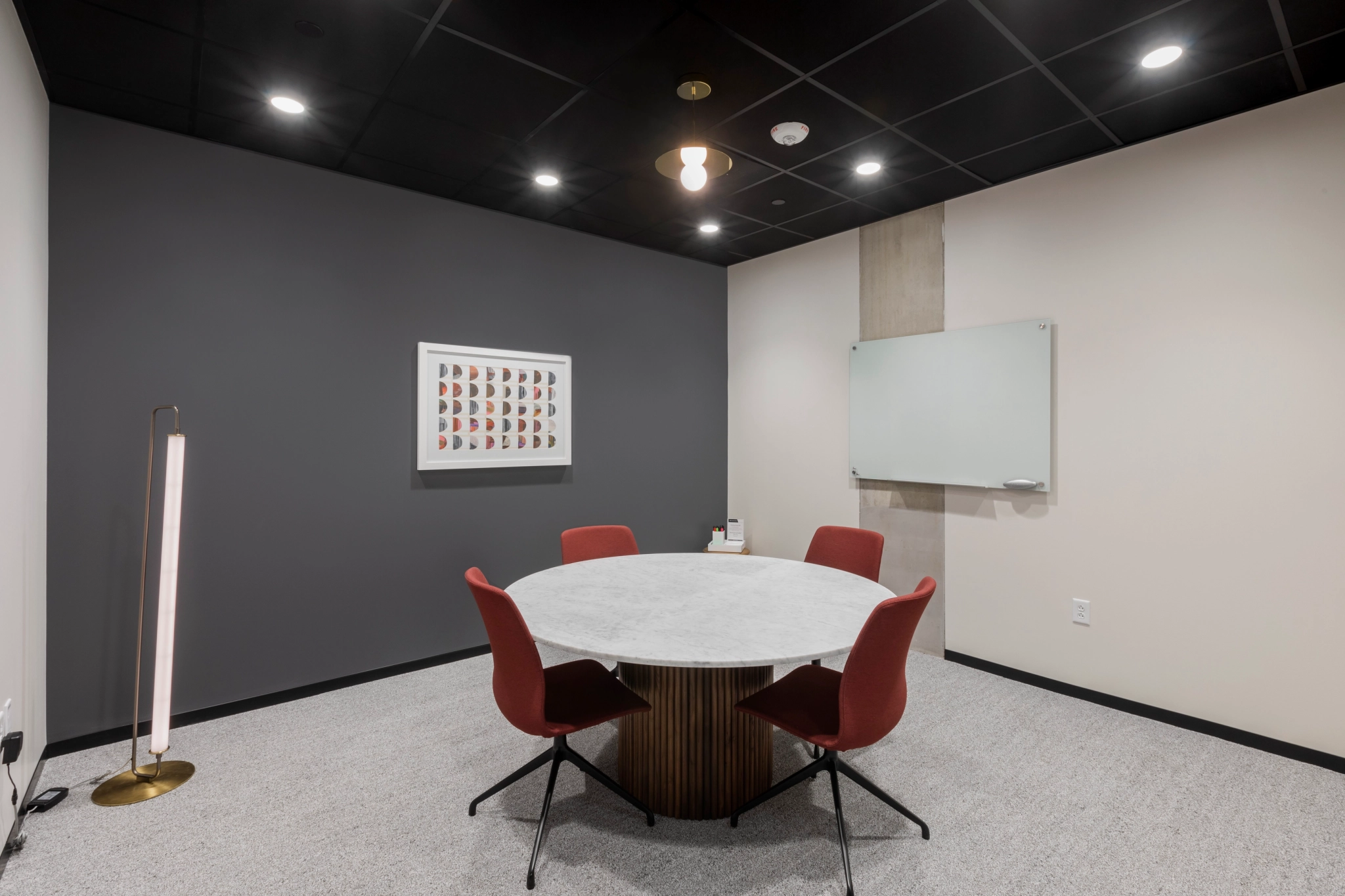 A coworking space in Washington with a round table and chairs.