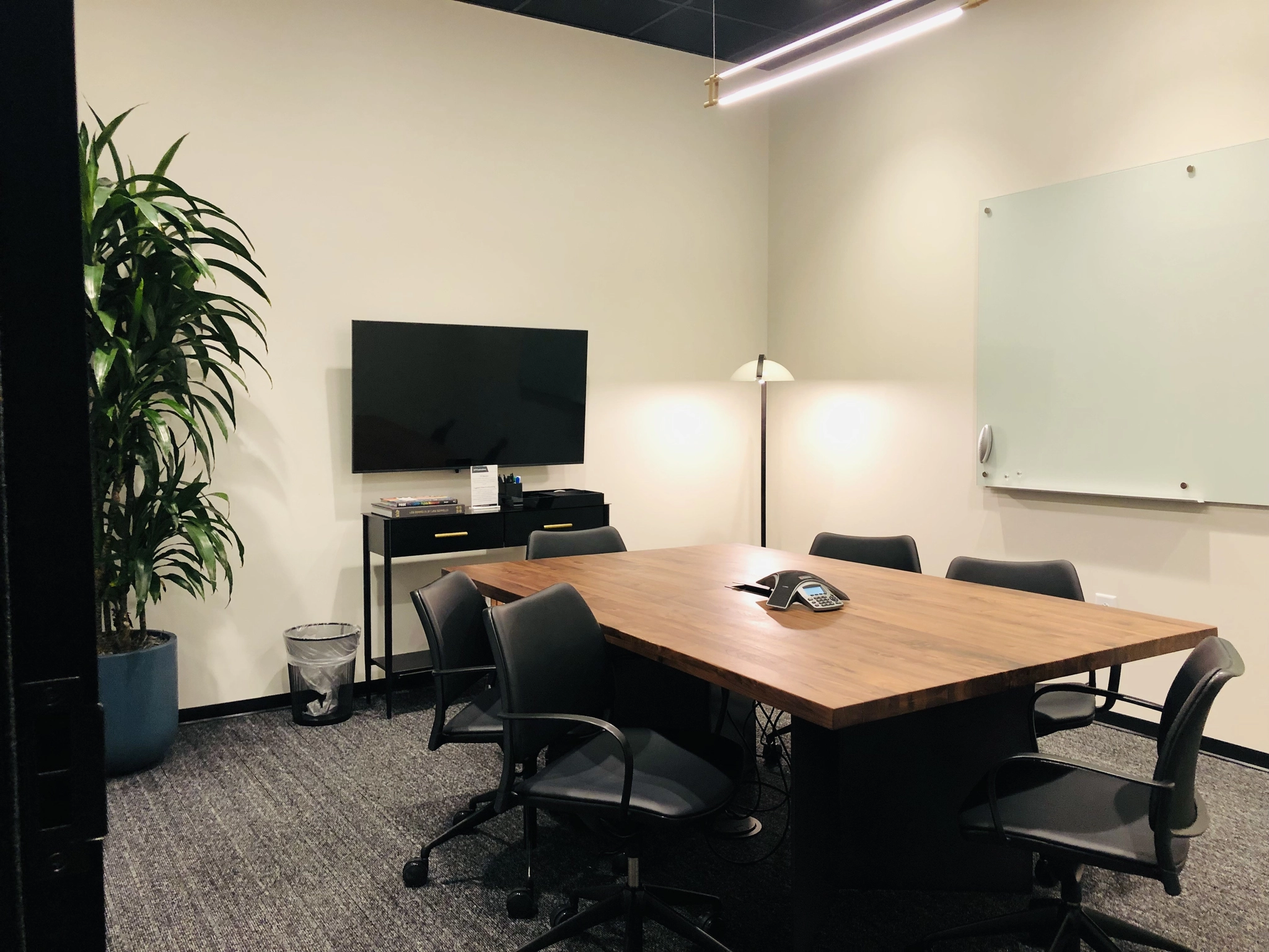 a large, bright meeting room with a large screen
