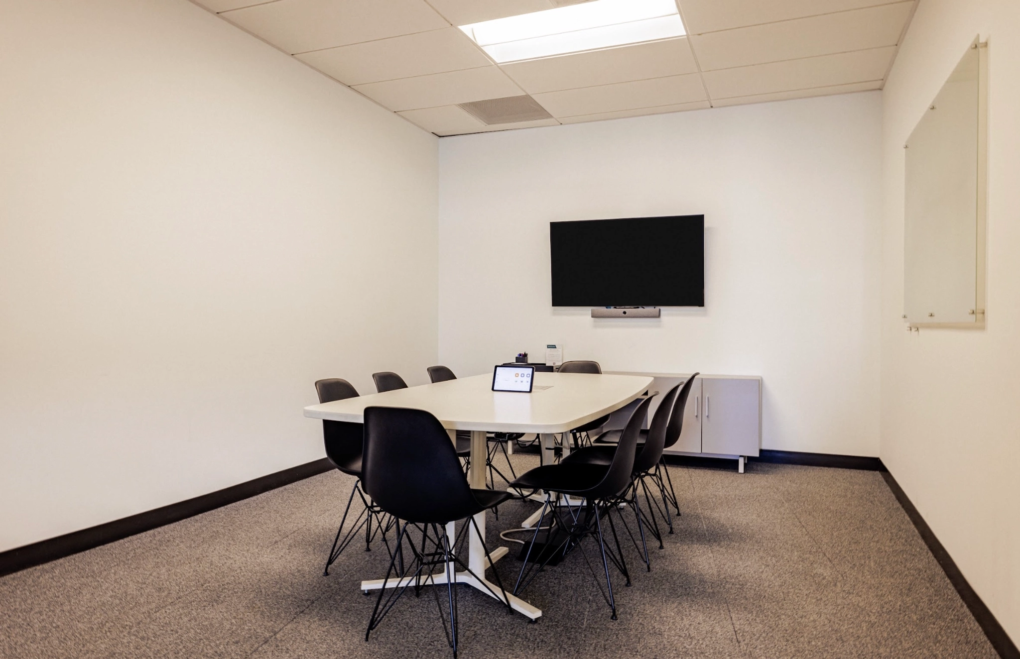 A San Francisco conference room with a table and chairs.