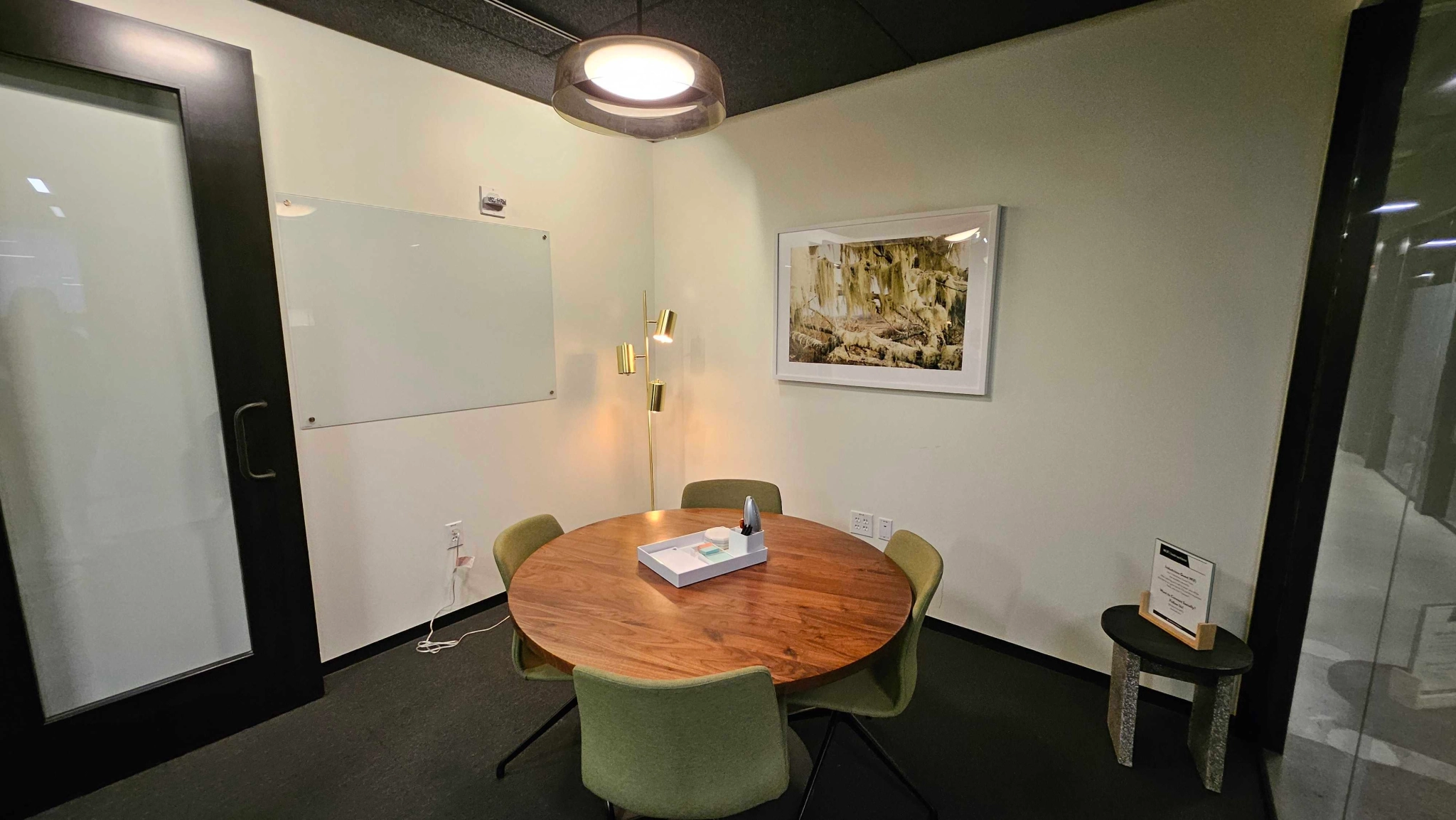 A Austin meeting room suitable for coworking, equipped with a table and chairs.