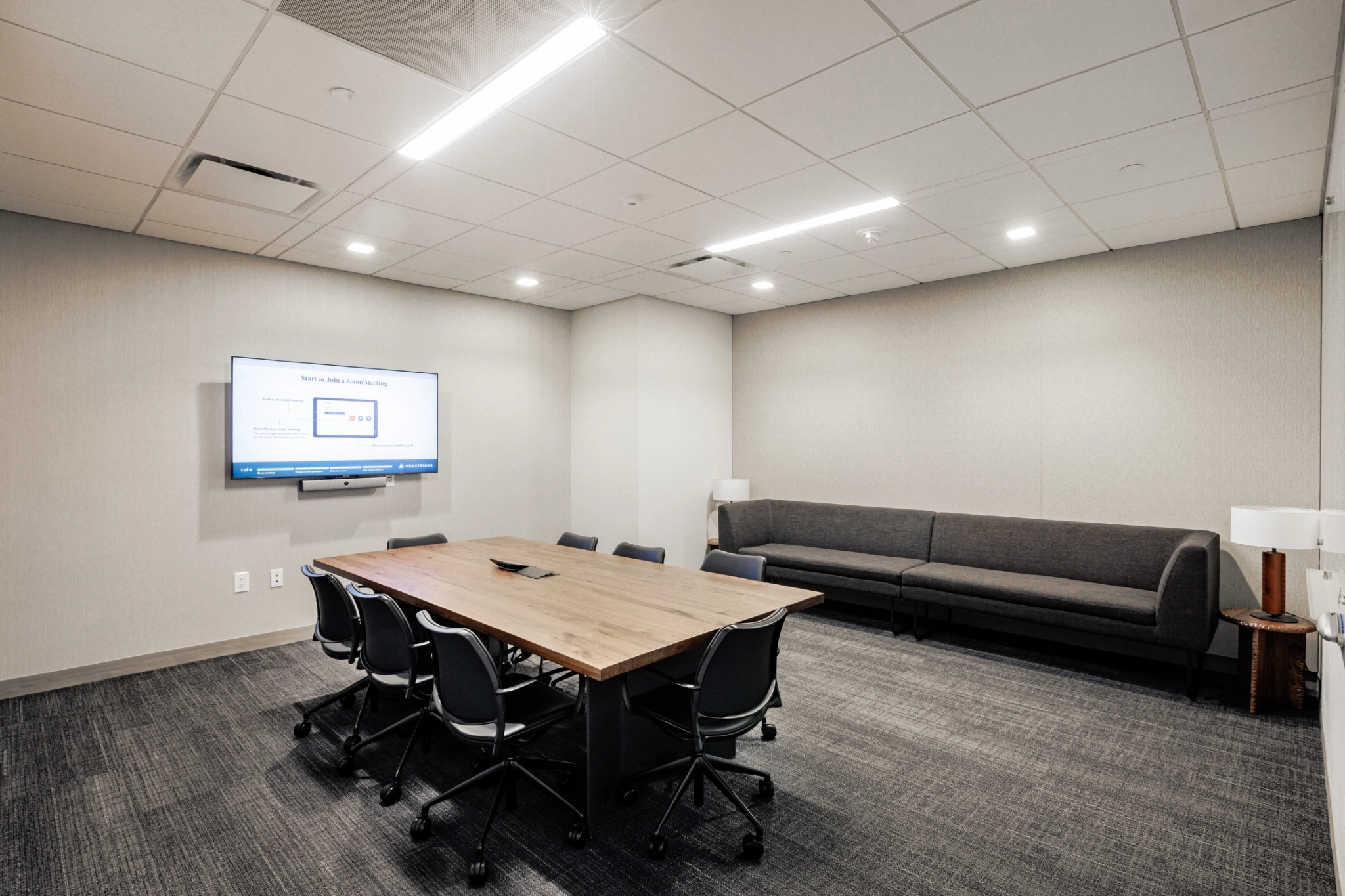 A coworking conference room in an office space in Bethesda, equipped with chairs and a TV.