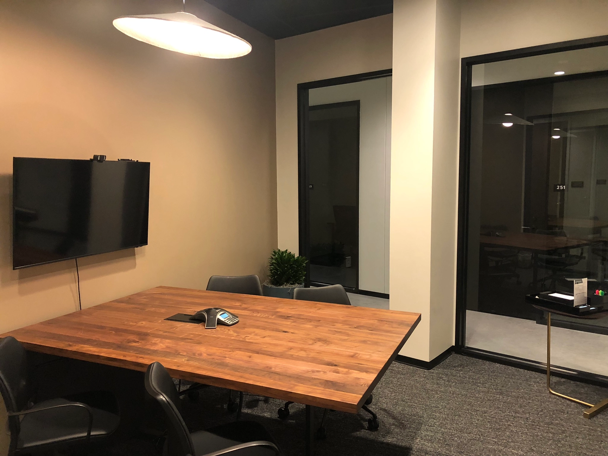 a large, bright meeting room with a large screen