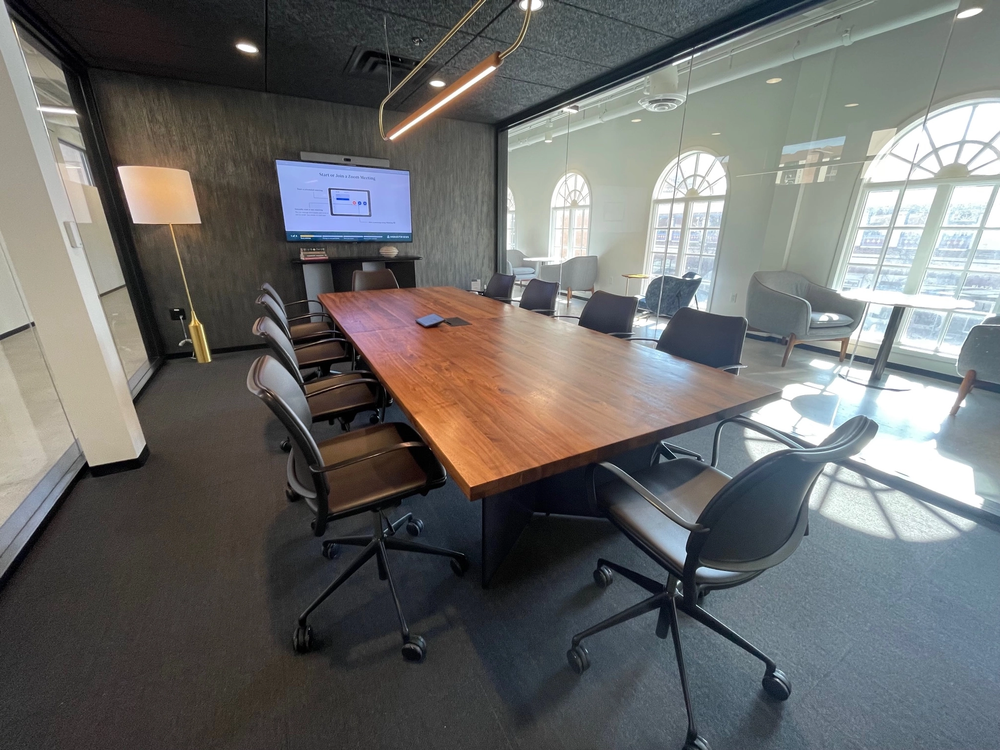 An office workspace with a large table and chairs.