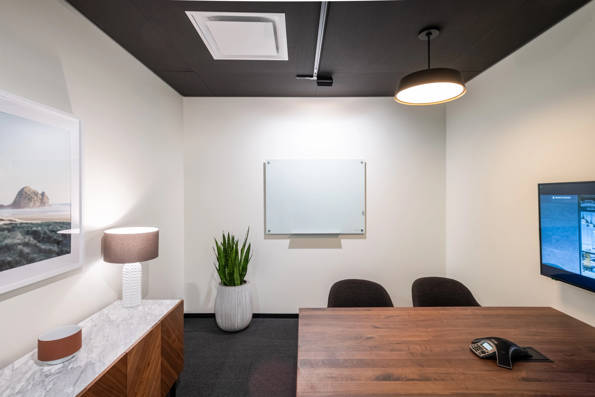 An office conference room in Costa Mesa equipped with a TV on the wall.