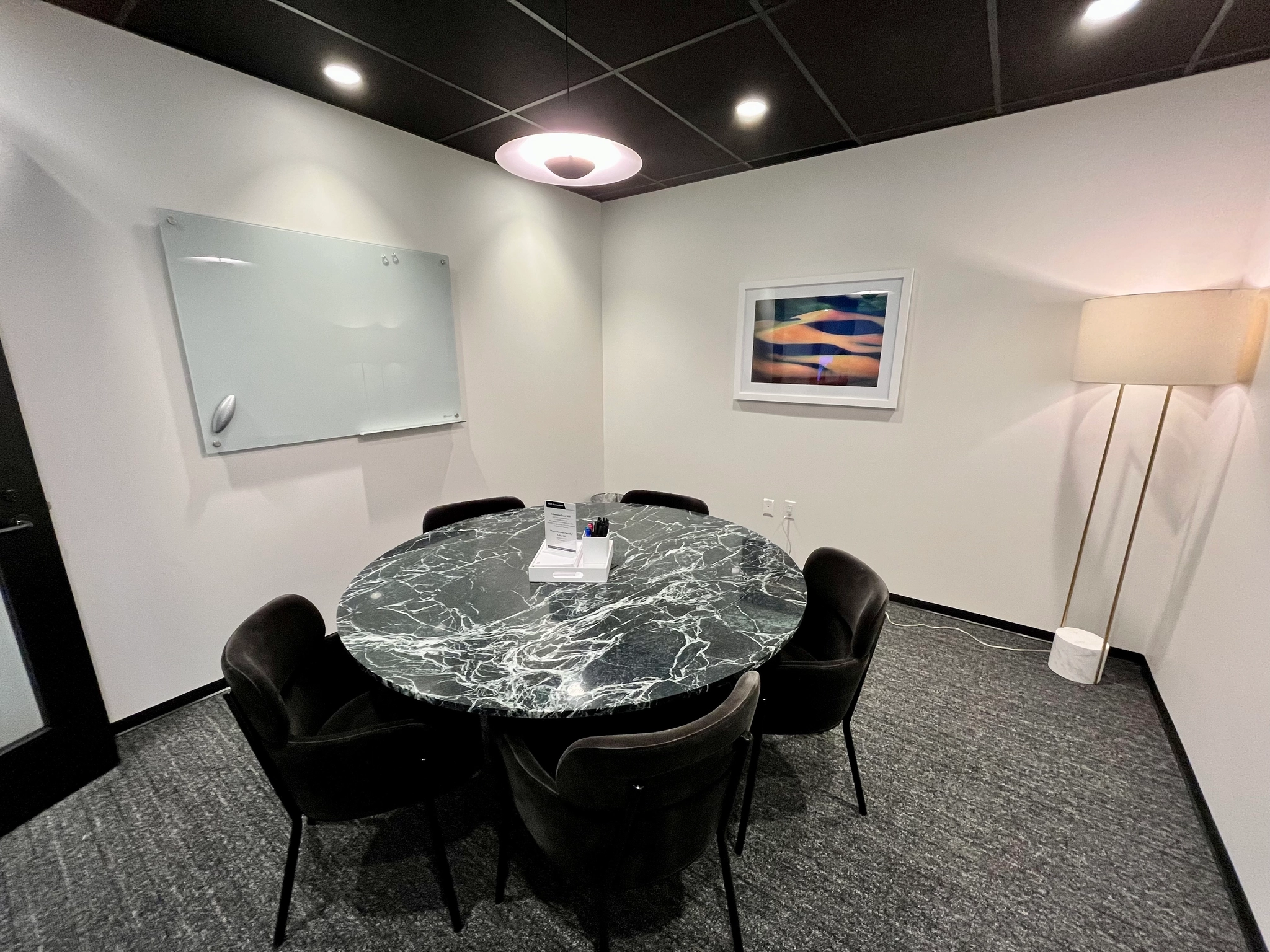 a large, bright meeting room with a large screen