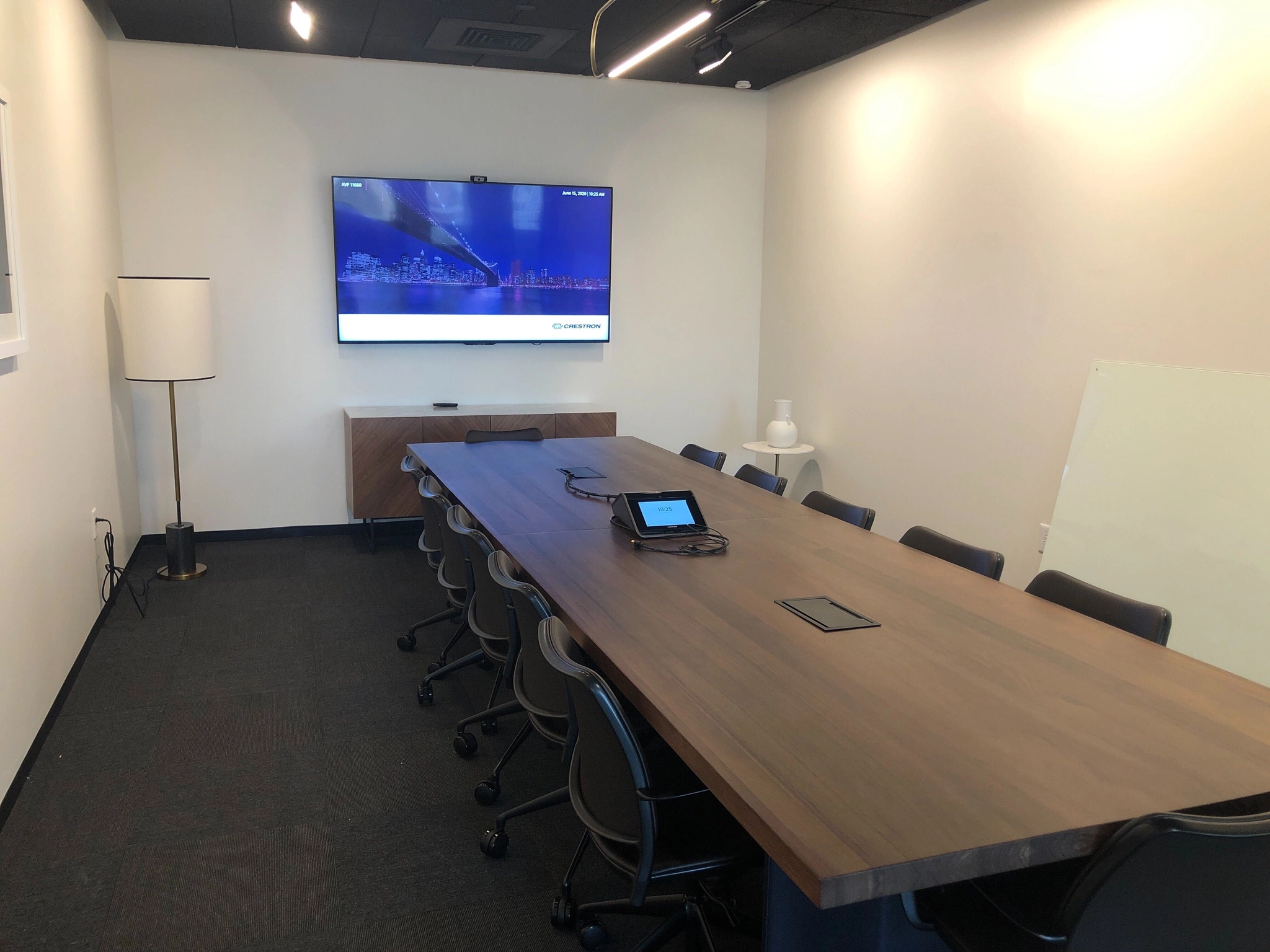 a large, bright meeting room with a large screen