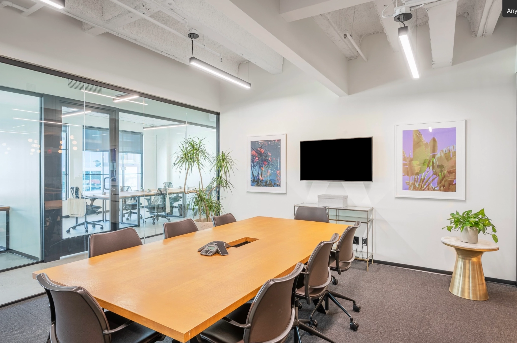 a large, bright meeting room with a large screen
