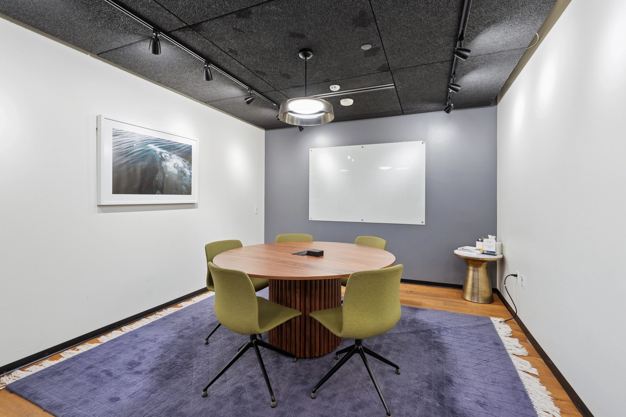 a large, bright meeting room with a large screen