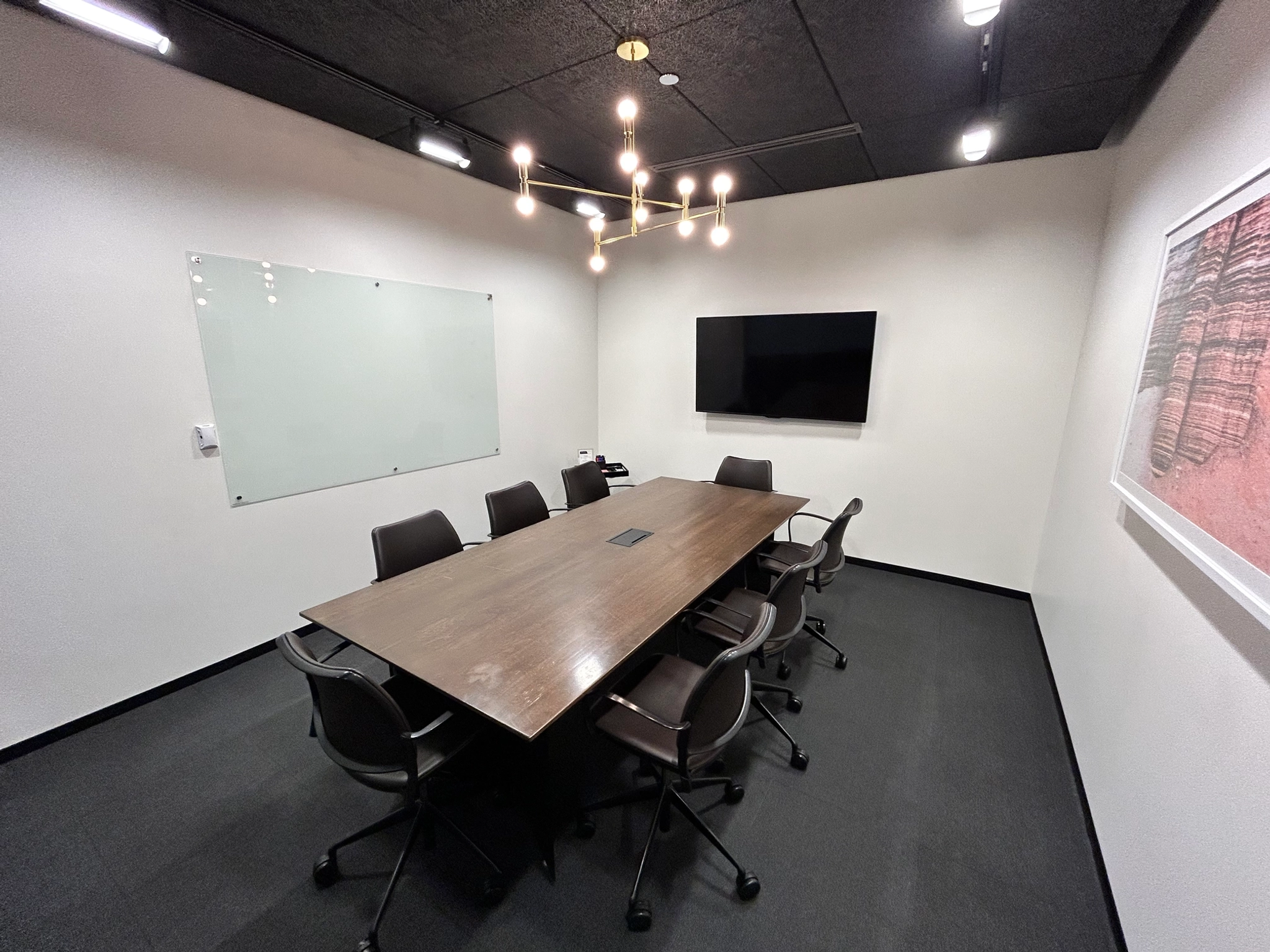 An Evanston meeting room with a large table and chairs.