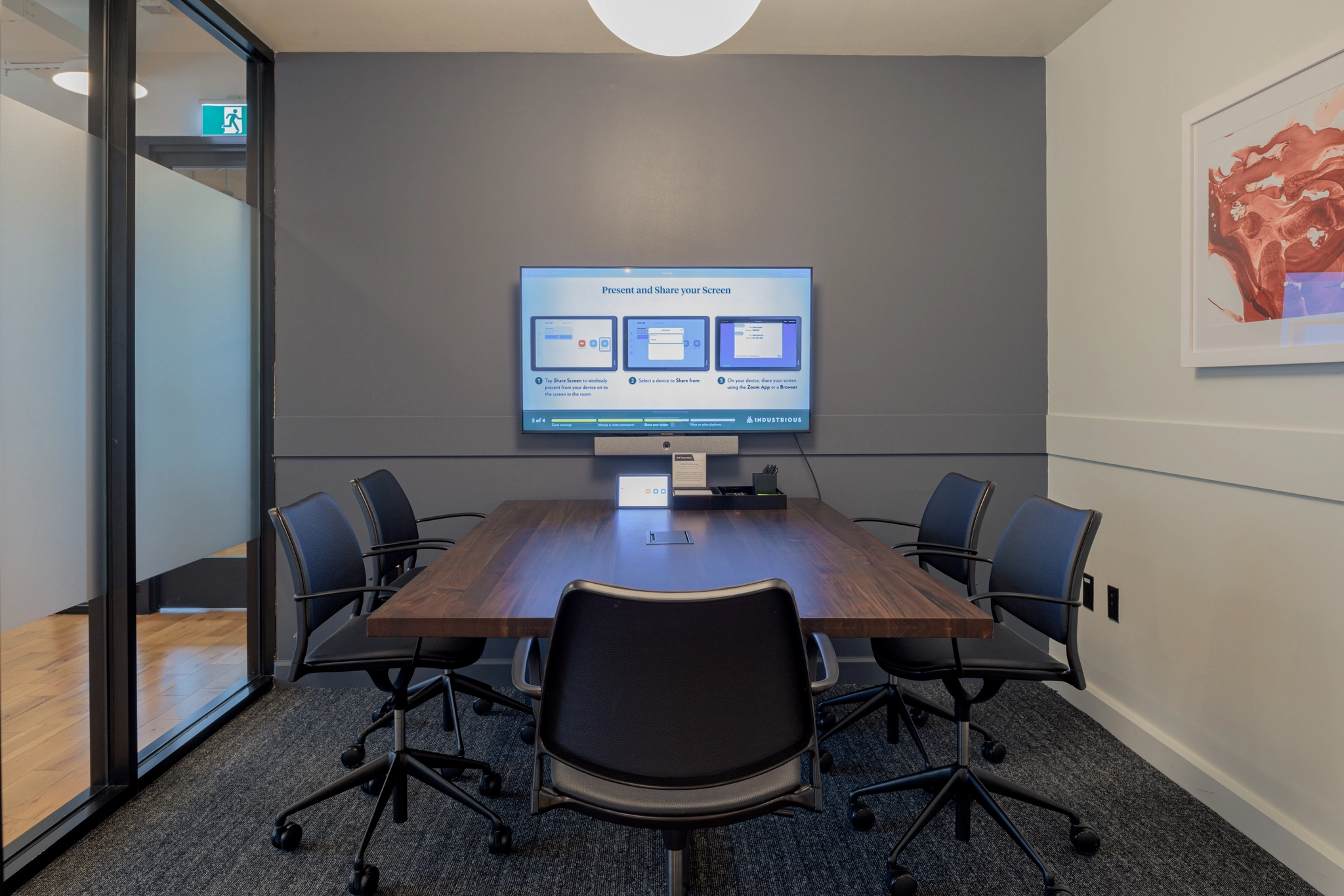 a large, bright meeting room with a large screen