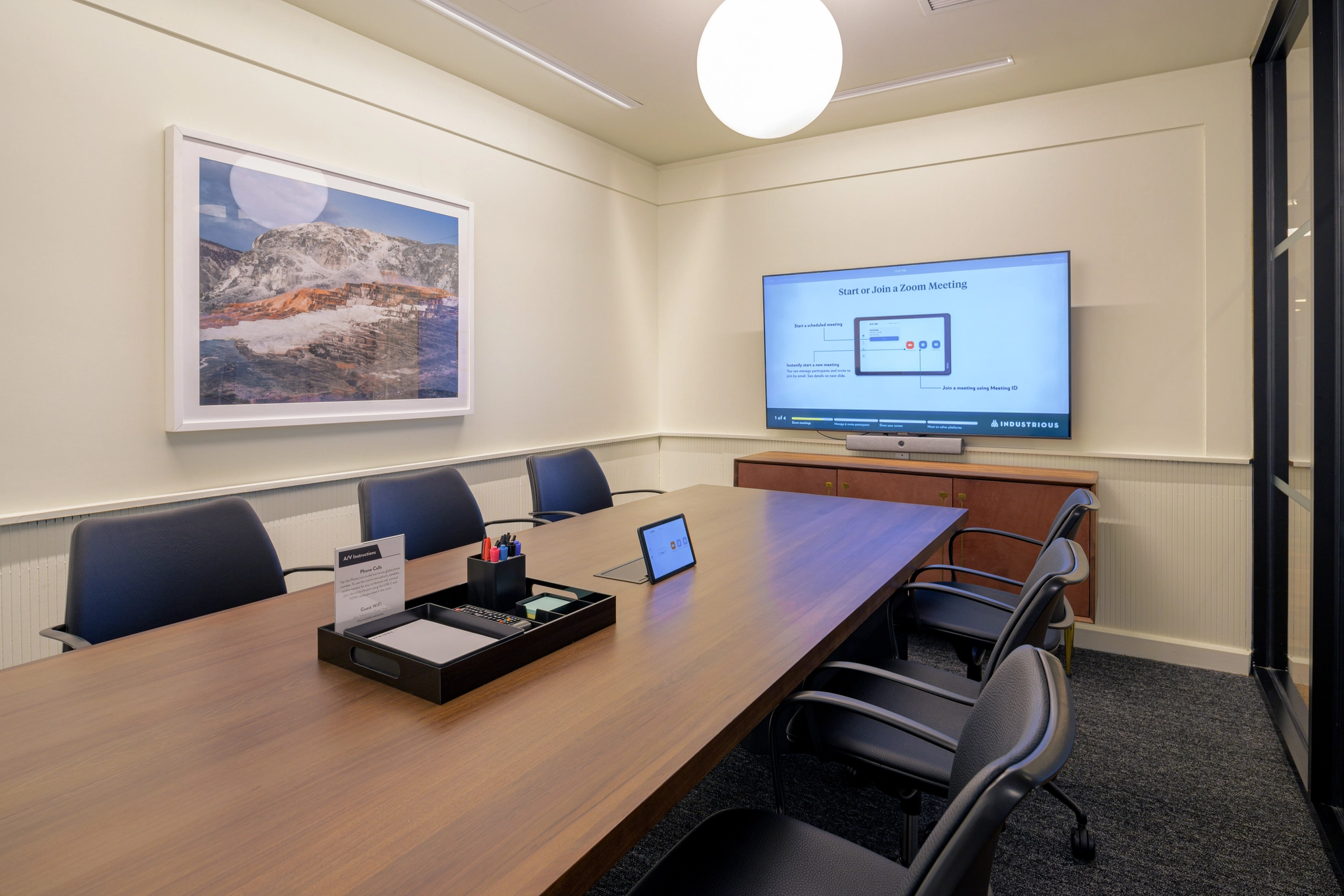 a large, bright meeting room with a large screen