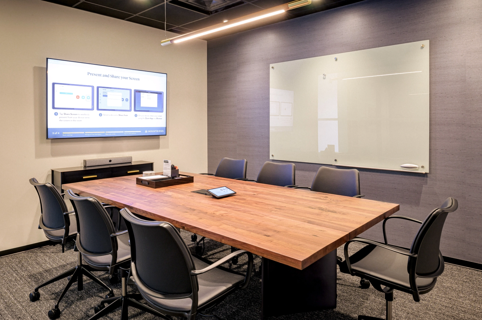 A coworking space with a wooden table and chairs.