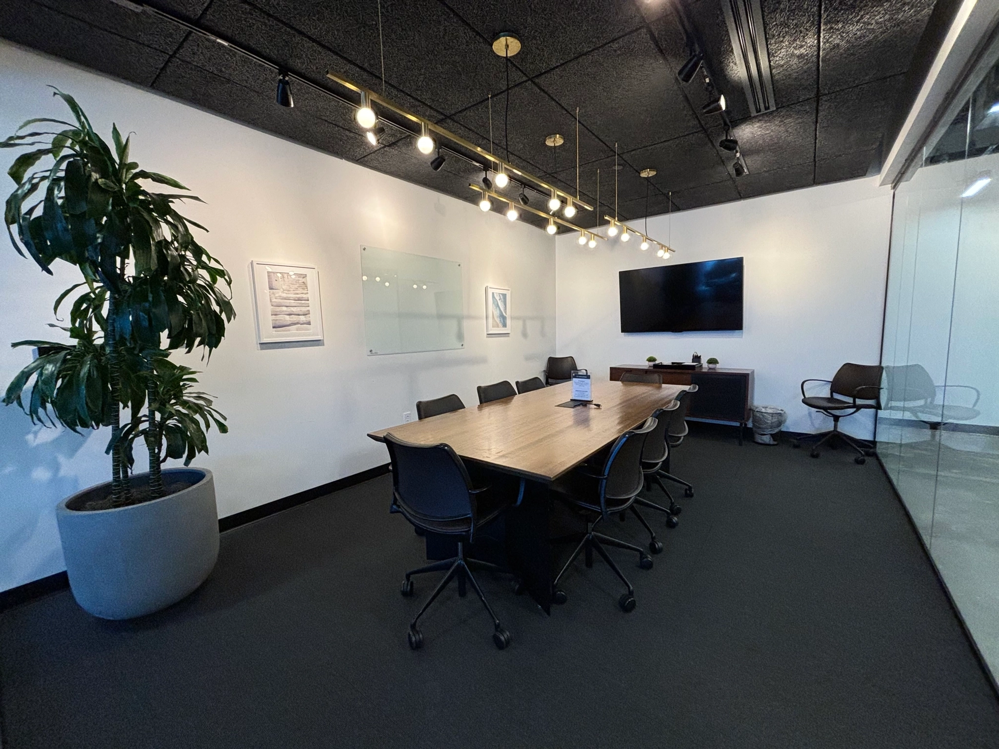 An office conference room with a black table and chairs in Nashville.