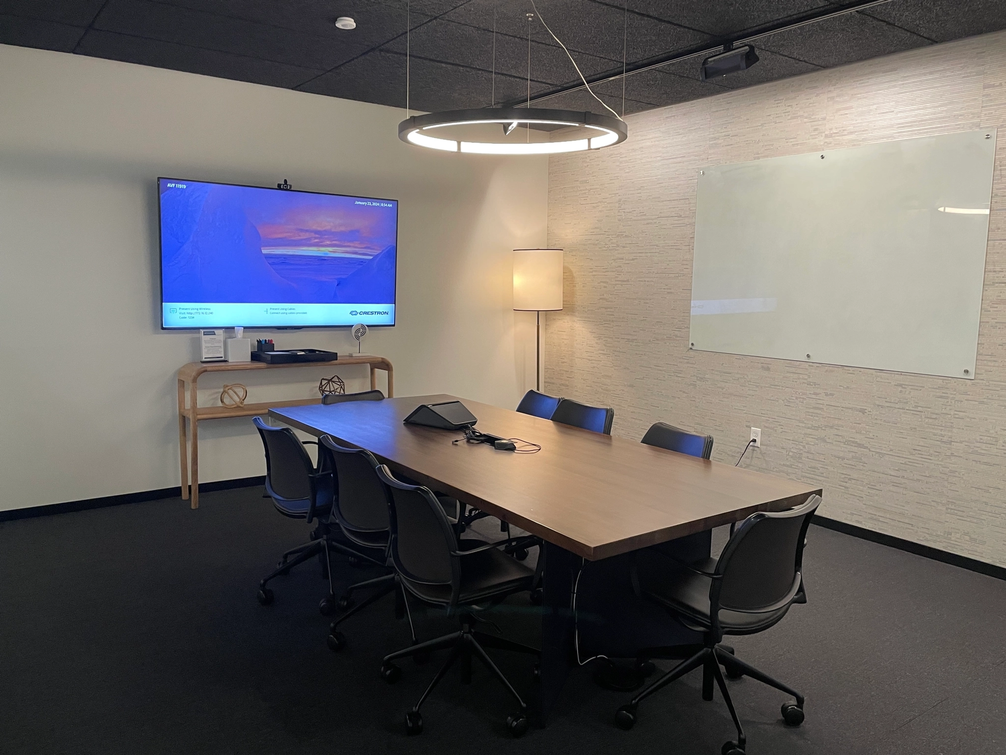 A Seattle conference room in an office space with a TV on the wall.