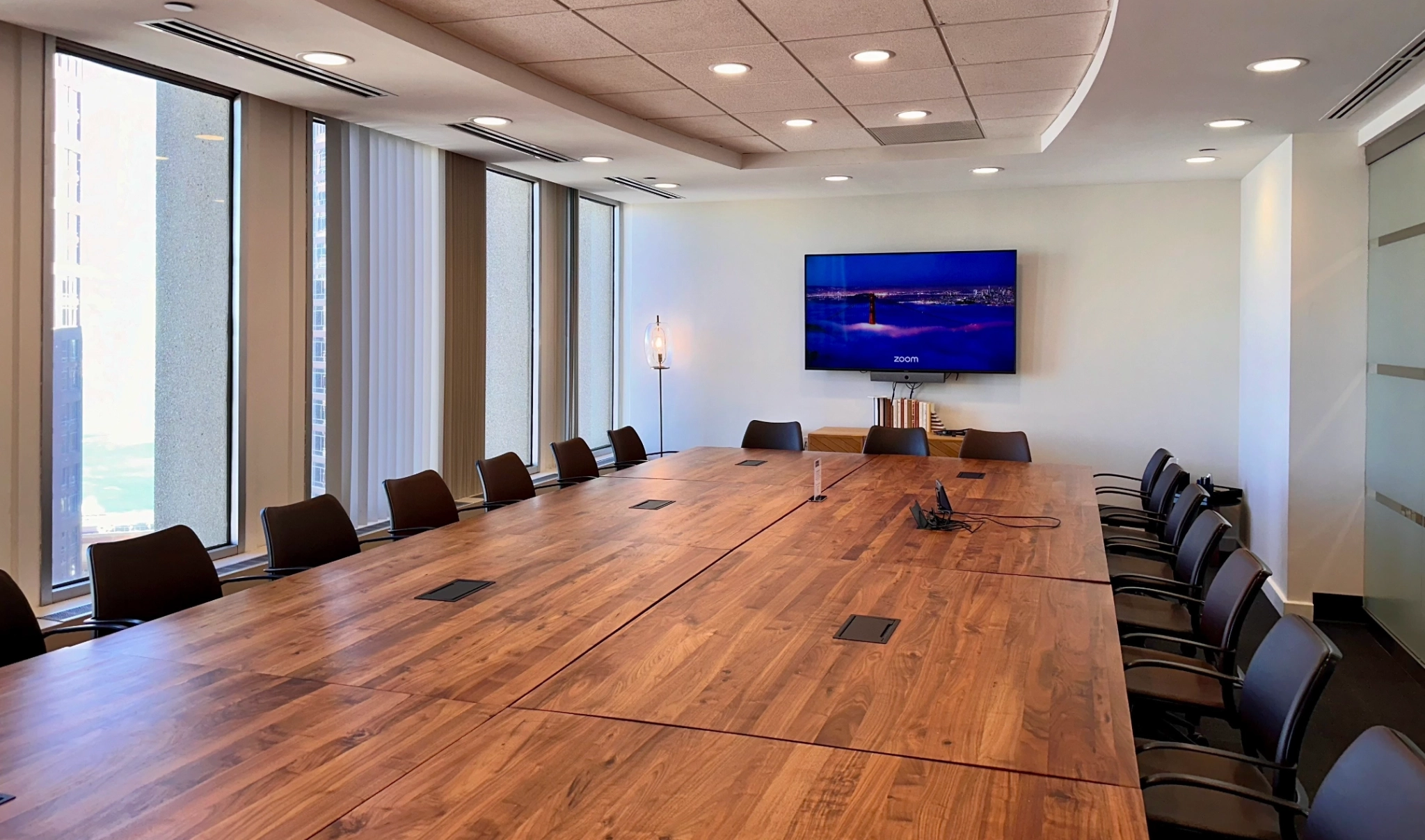 A meeting room in Boston with a large table and chairs.