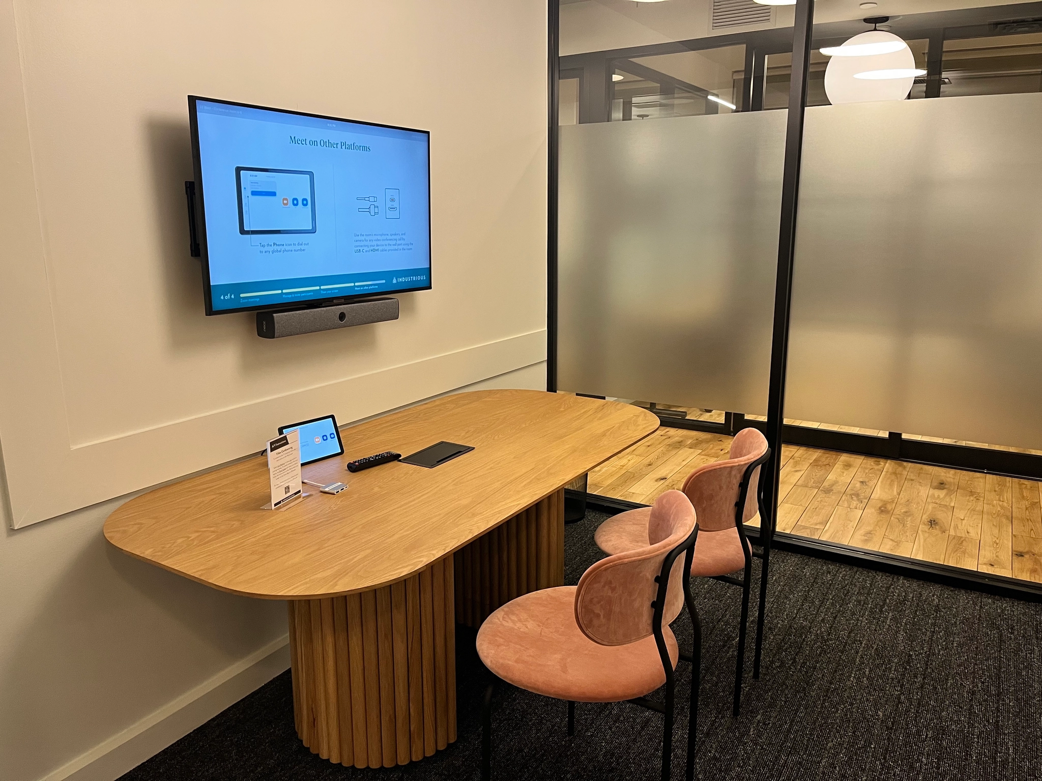 a large, bright meeting room with a large screen